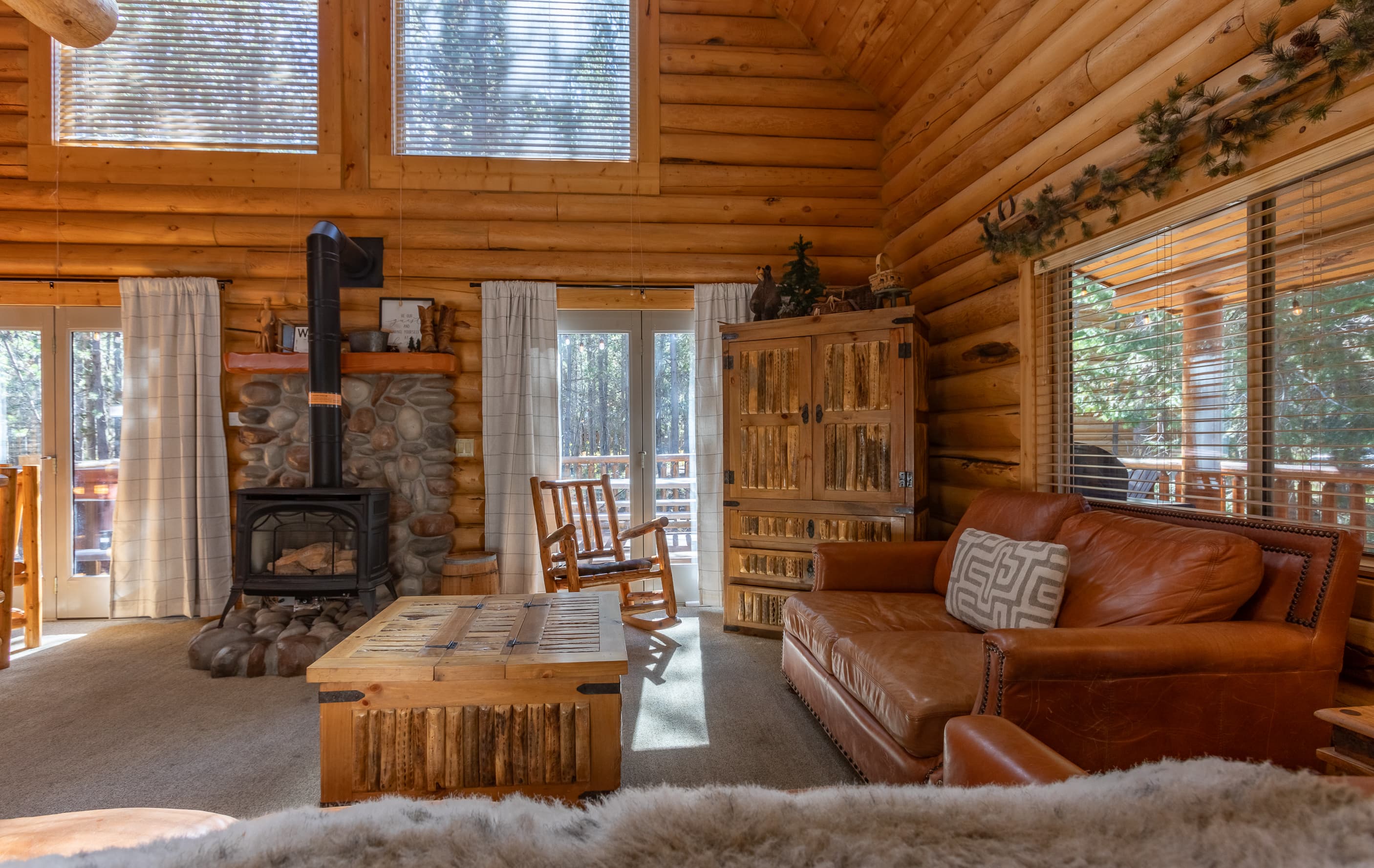 Living area with rustic vibes, featuring hardwood floors and classic wooden beams.