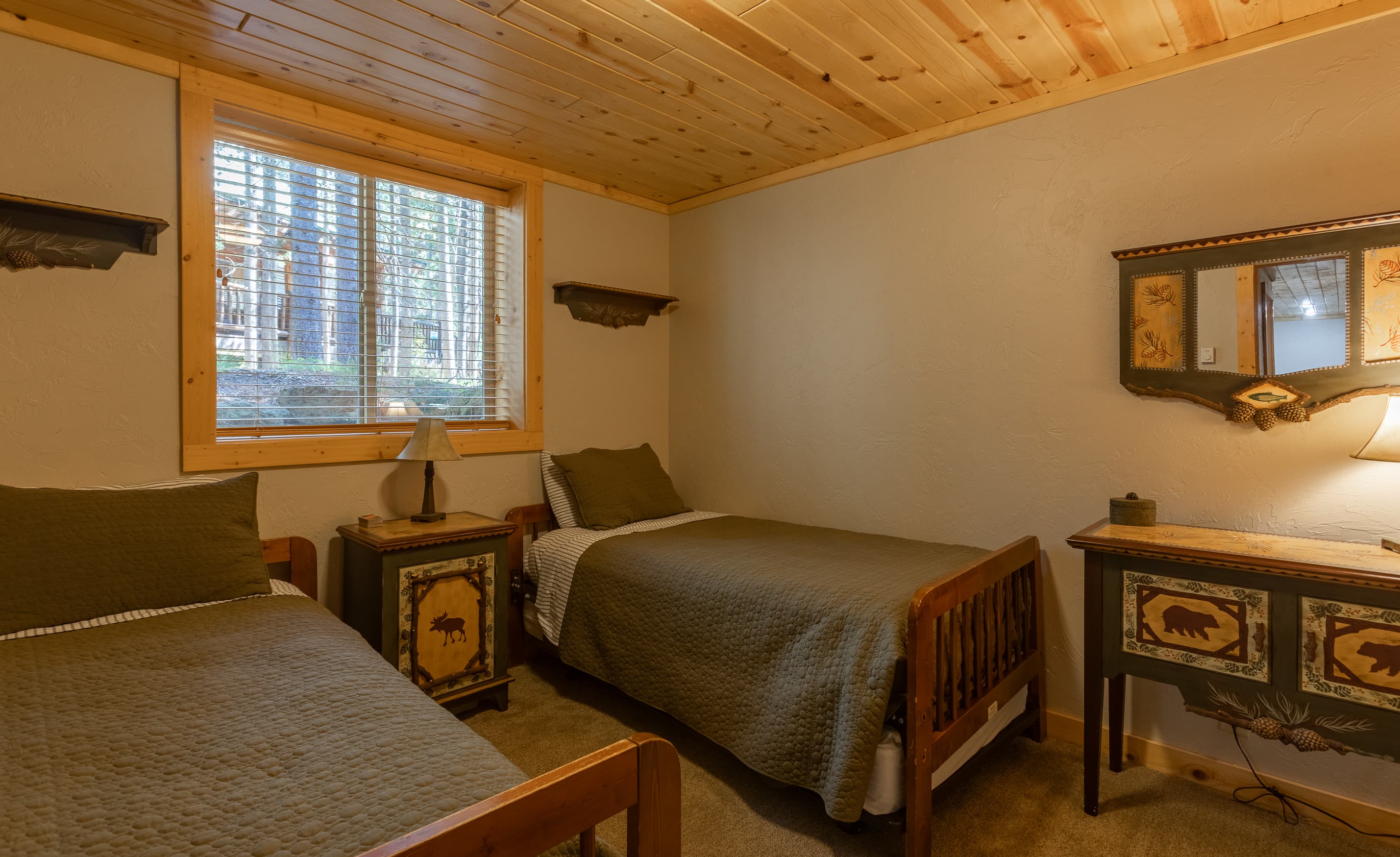 Enjoy a snug retreat in our cozy room with two comfy twin beds in Bedroom 5.
