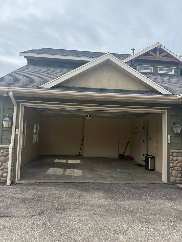 Two-car garage with plenty of room for parking and convenient space to hang and store ski gear after a day on the mountain.