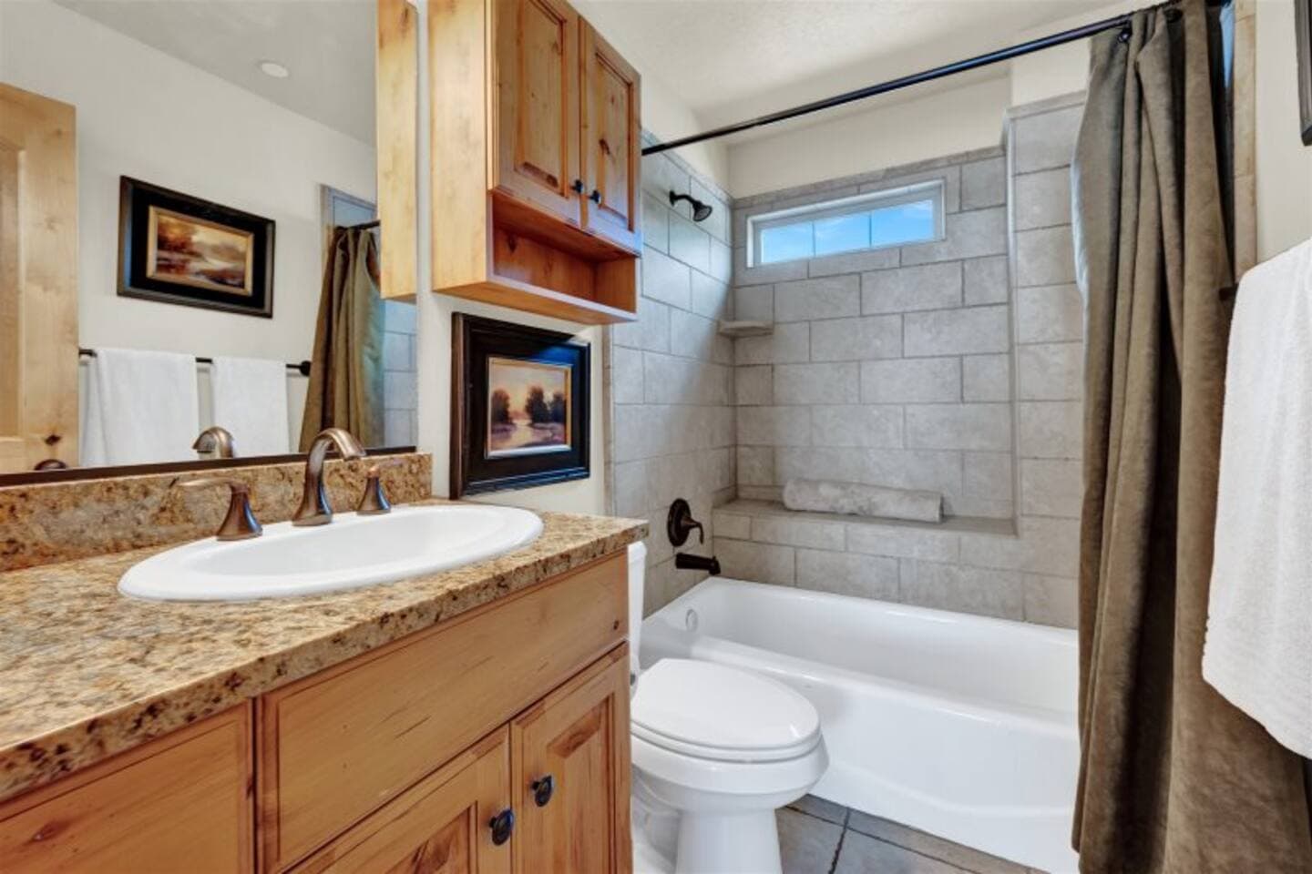 Full bathroom with tub/shower combo.