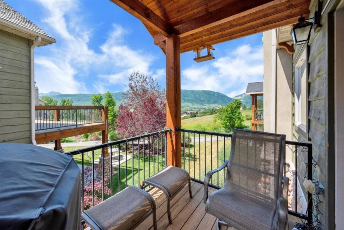 The deck features comfortable seating and a grill, creating the perfect spot for outdoor meals, relaxation, and enjoying the fresh air with friends and family.