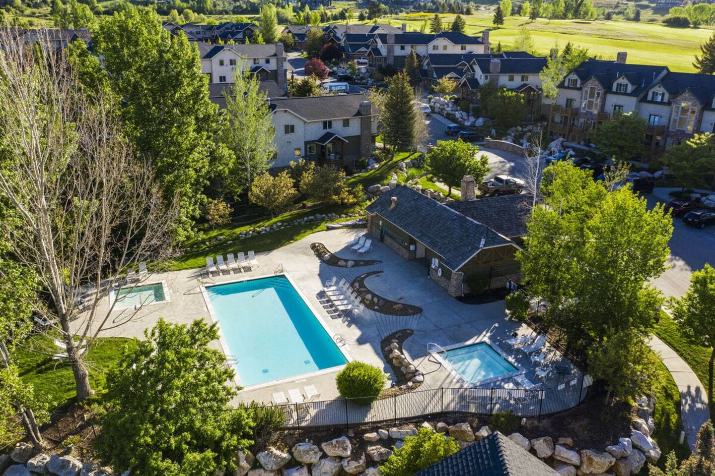Second clubhouse equipment with two hot tubs, a seasonal pool, and lounge chairs.