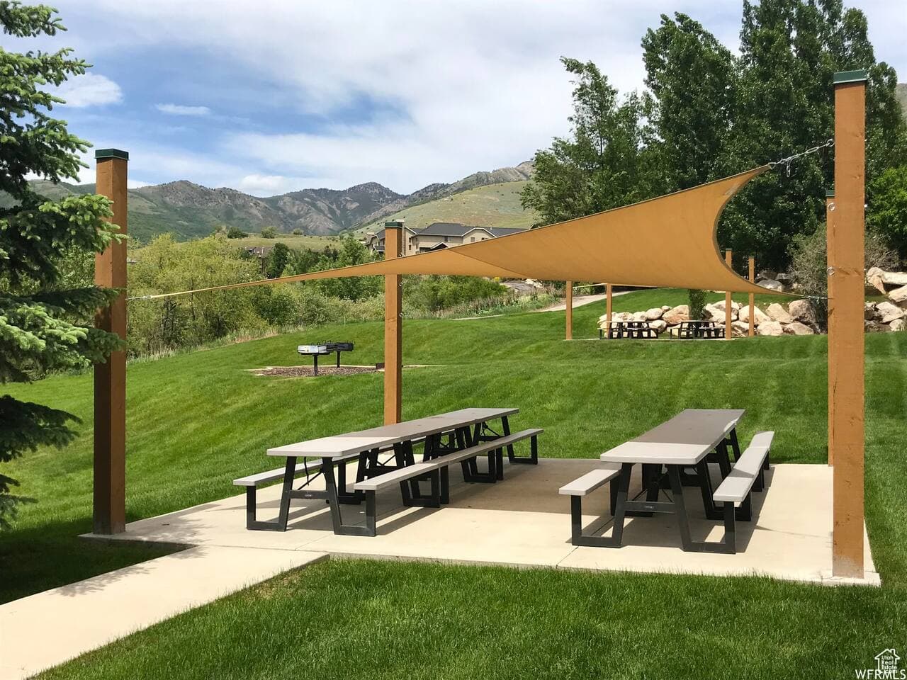 A relaxed picnic area with shaded covers offers a comfortable spot to gather outdoors.