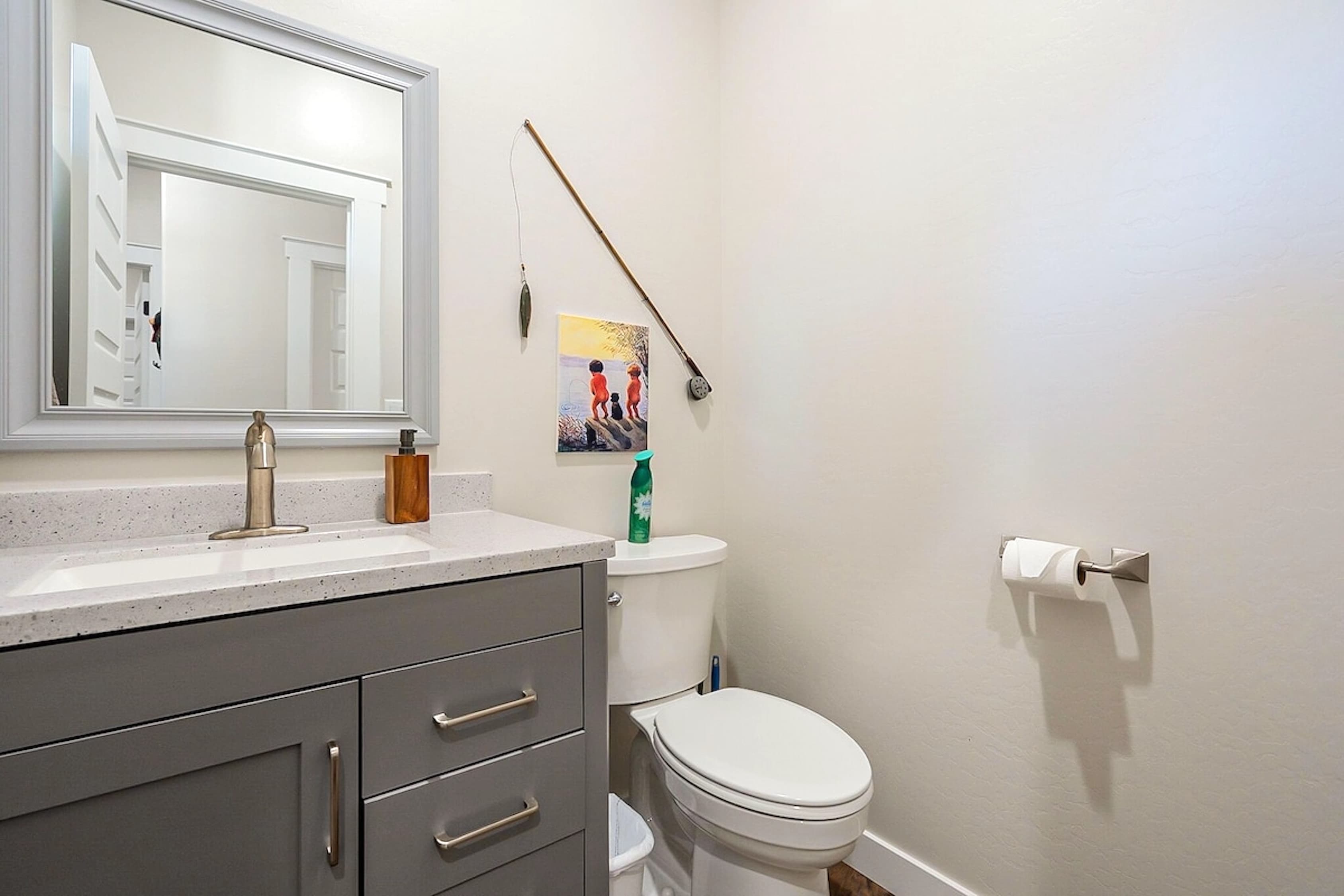 A cozy touch of mountain charm — this bright and stylish half bath adds comfort and convenience to your getaway.