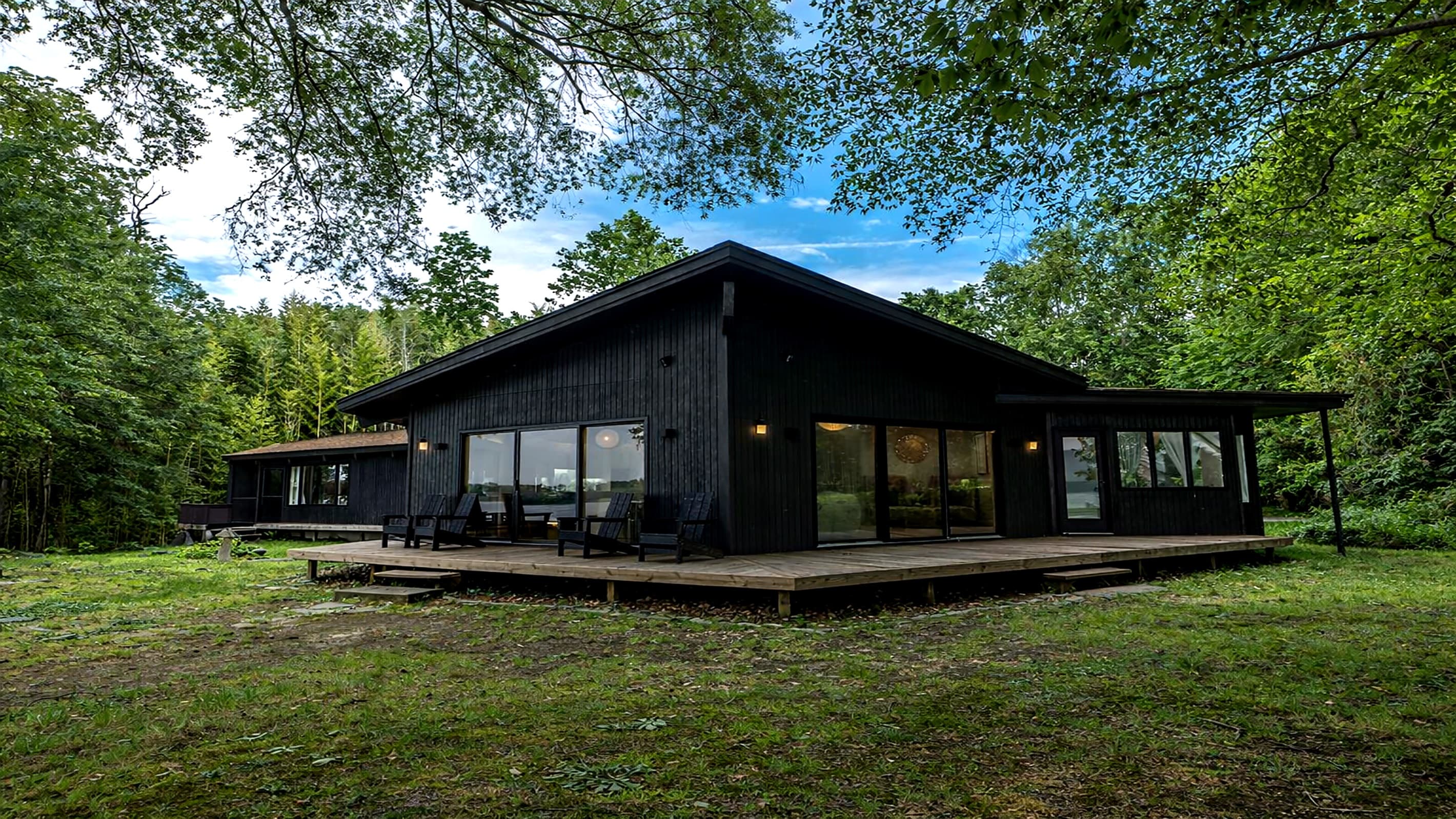 Riverfront Estate — Striking Black Modern Exterior, Japanese-Zen Architecture