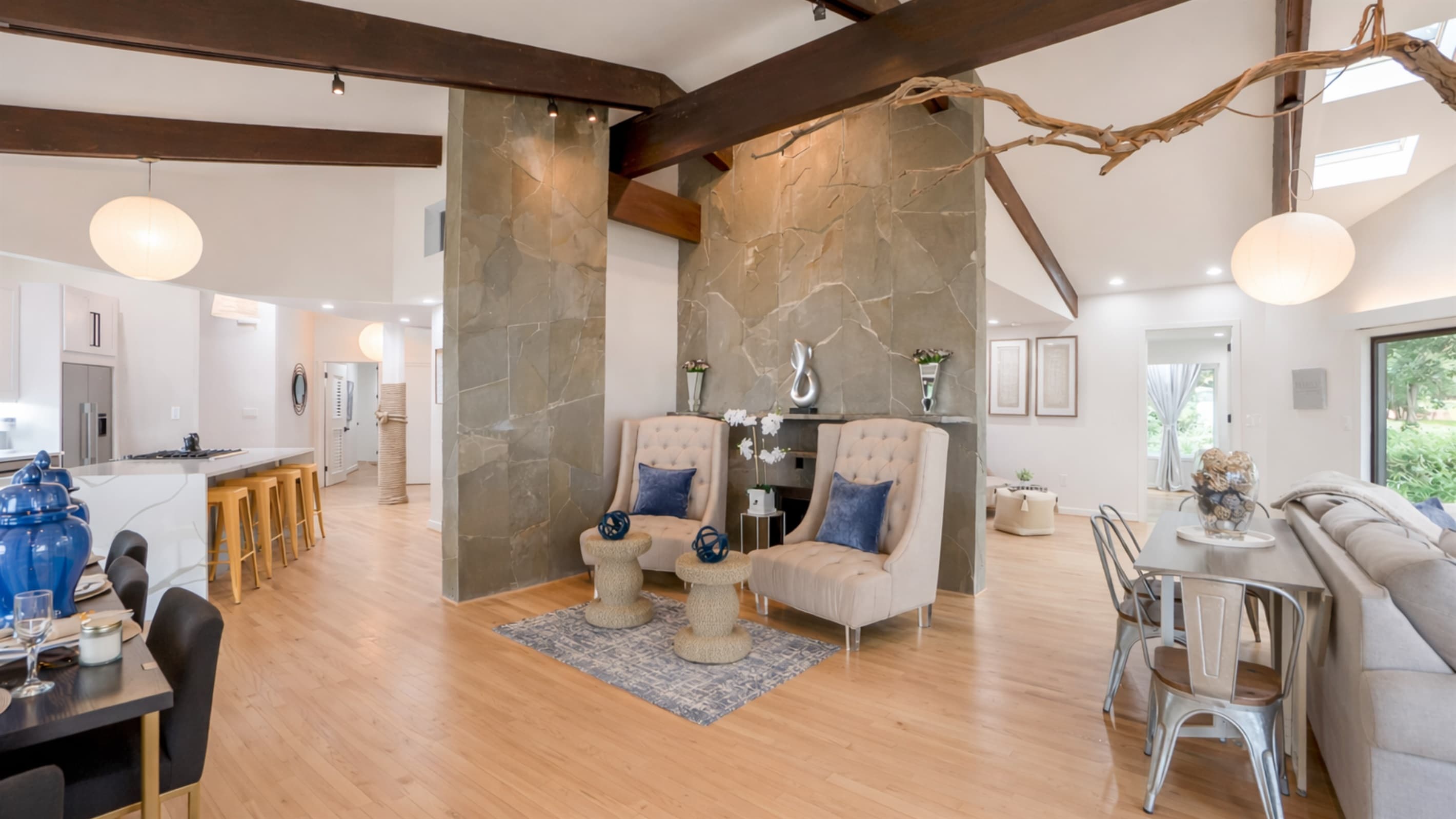 Gathering Space — Concrete Accent Wall, Designer Furnishings, Open Living Area