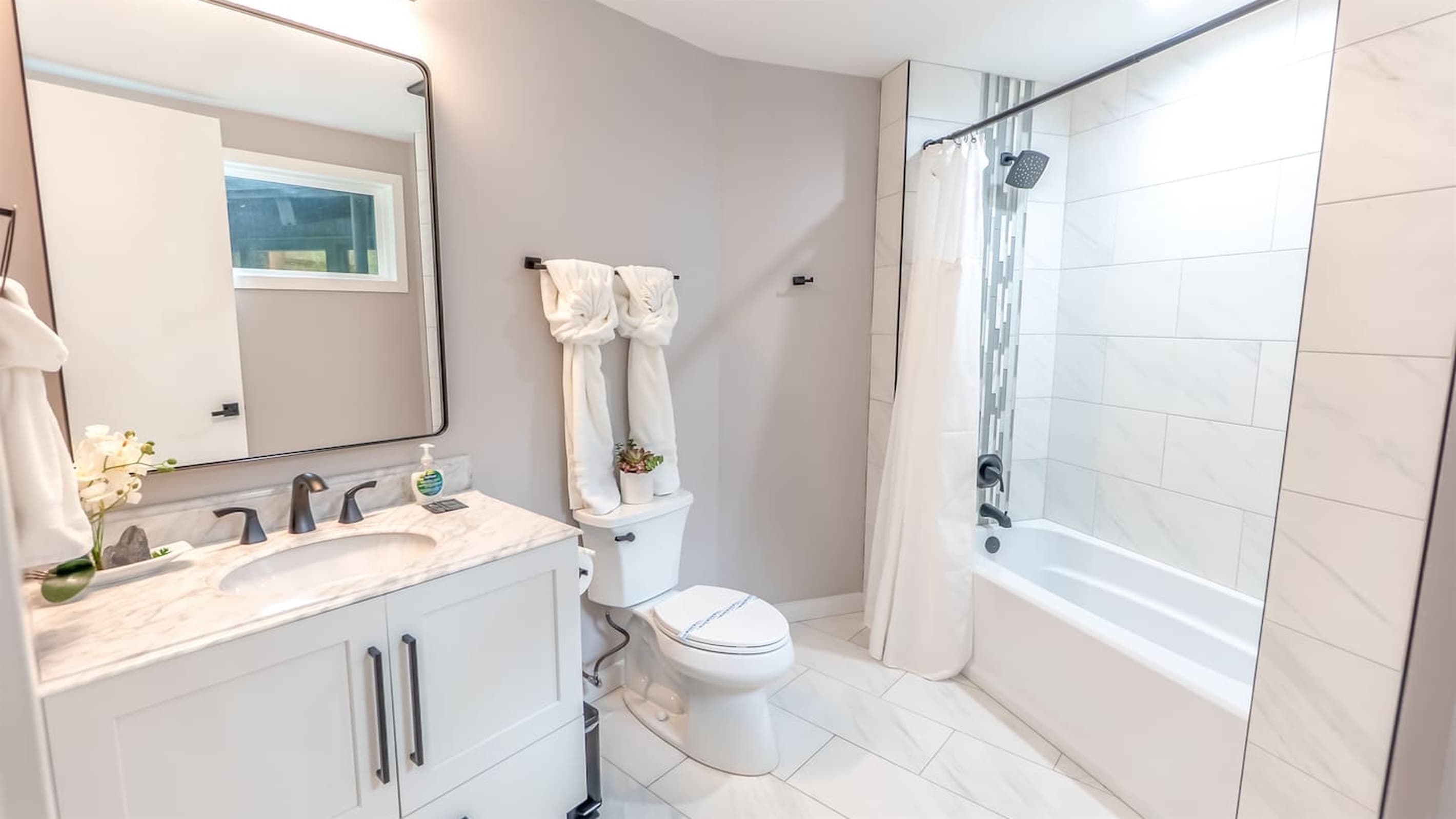 En-Suite Bath — Walk-In Shower, Stylish Tile Work, Bright Natural Light