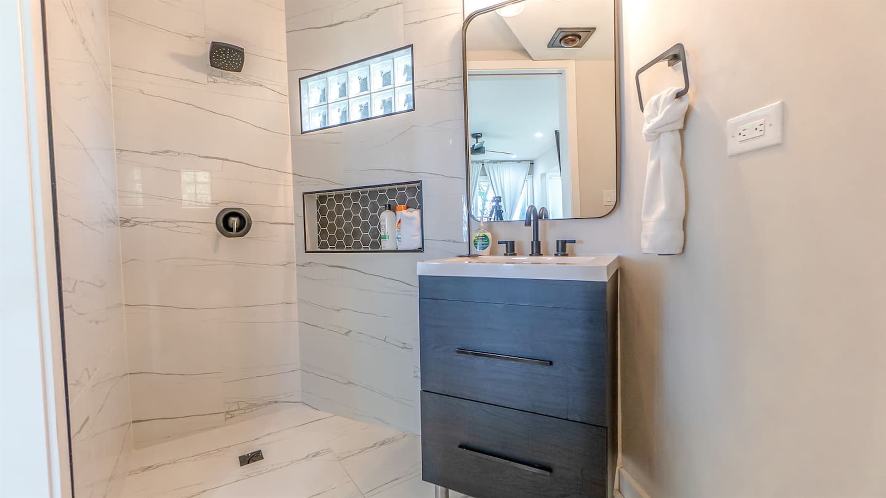 En-Suite Bath — Blue Accent Tile, Glass Shower Enclosure, Curated Finishes