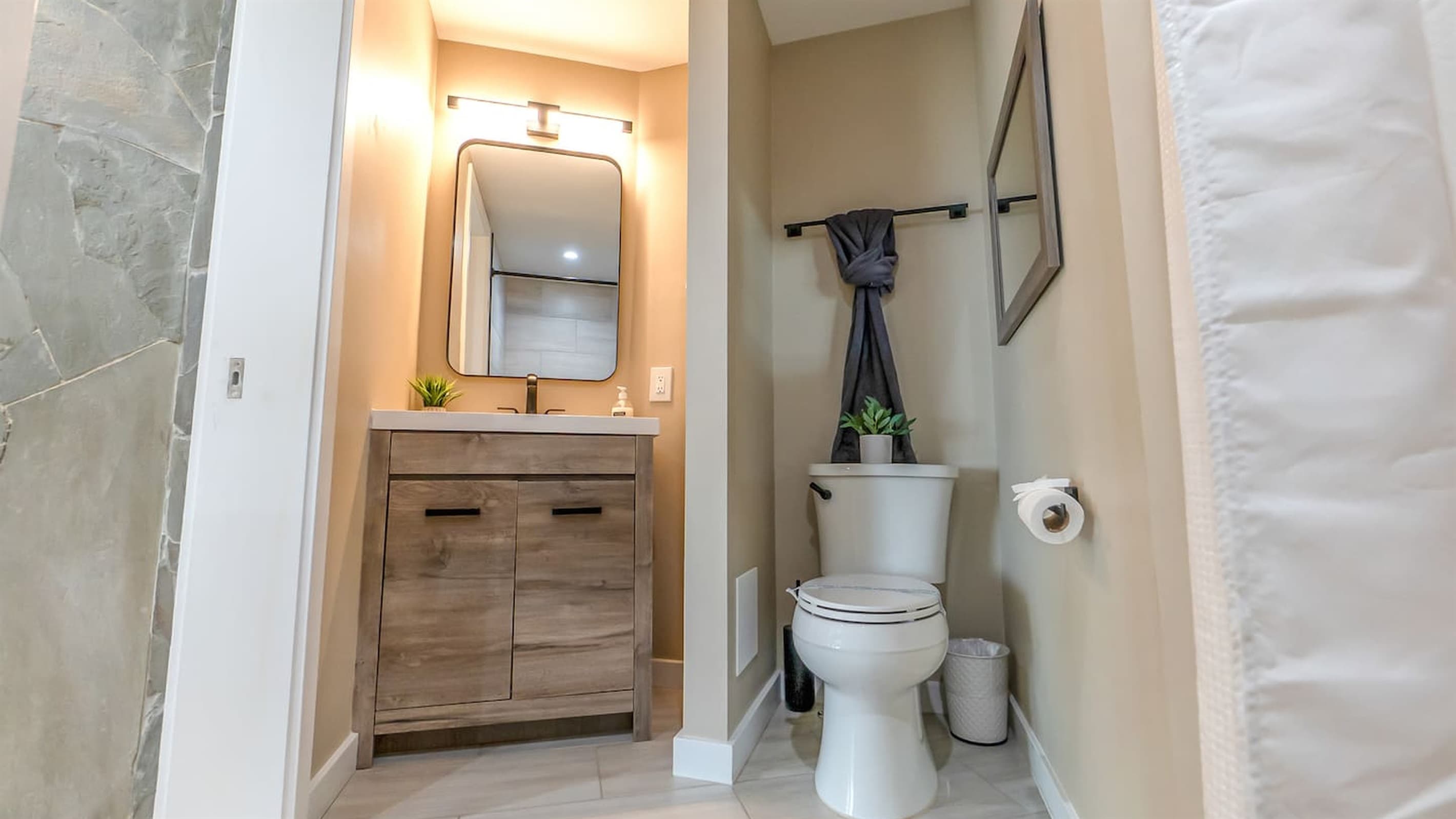 En-Suite Bath — Natural Wood Accents, Warm Tones, Designer Fixtures
