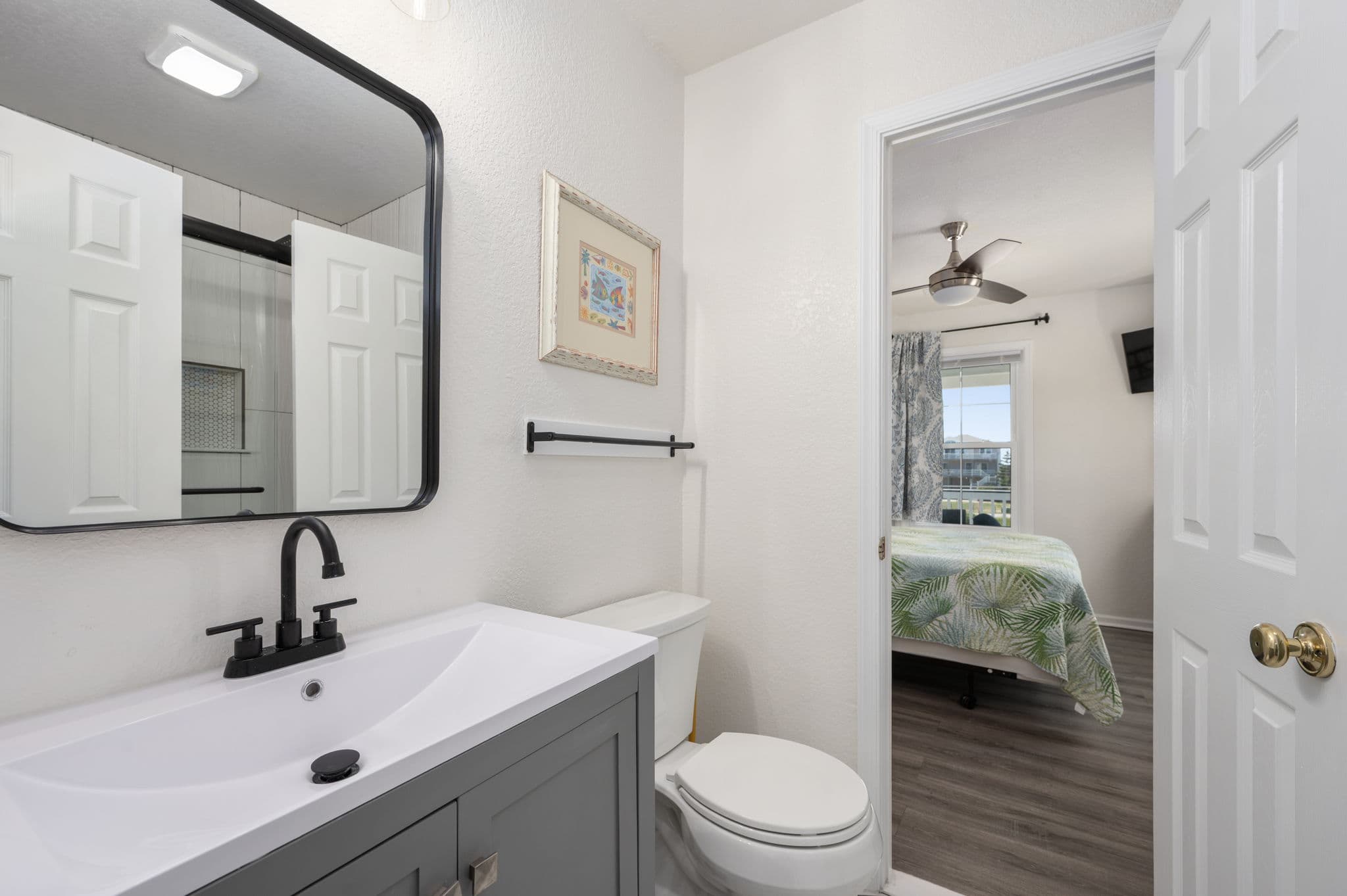 BR3 Ensuite — Stylish Modern Vanity with Direct Bedroom Access | Coastline Haven, Outer Banks