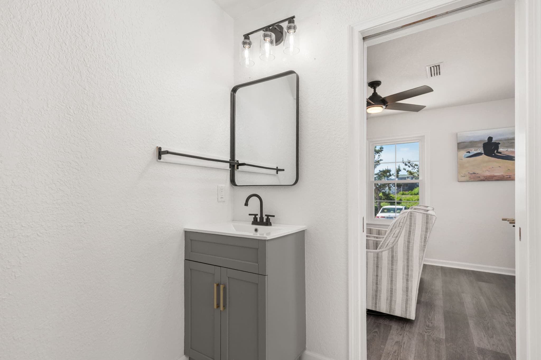 Main Floor Bathroom — Sleek Vanity with Matte Black Finishes | Coastline Haven, Nags Head OBX