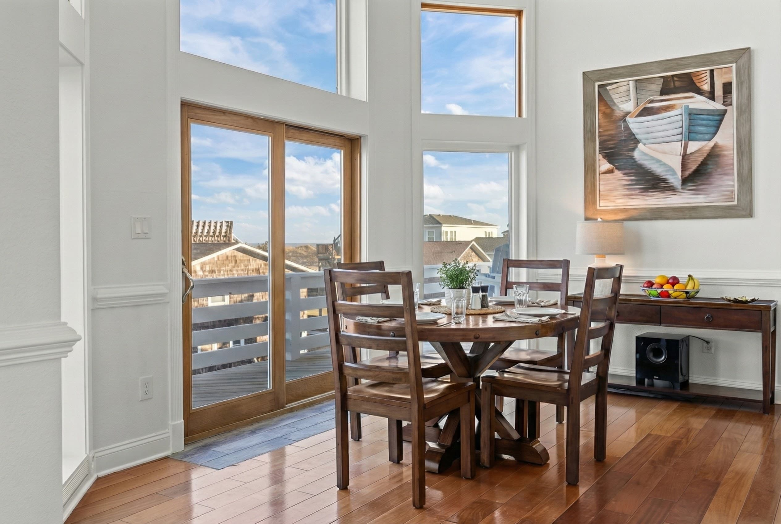 Bright Dining Area with Sliding Glass Doors Framing the Ocean — Meals with a View | Angler's Retreat, Outer Banks