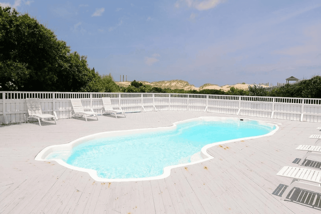 Expansive Oceanfront Pool Deck with Lounge Chairs — The Perfect Place to Unwind After a Beach Day | The Fitzgerald, Outer Banks