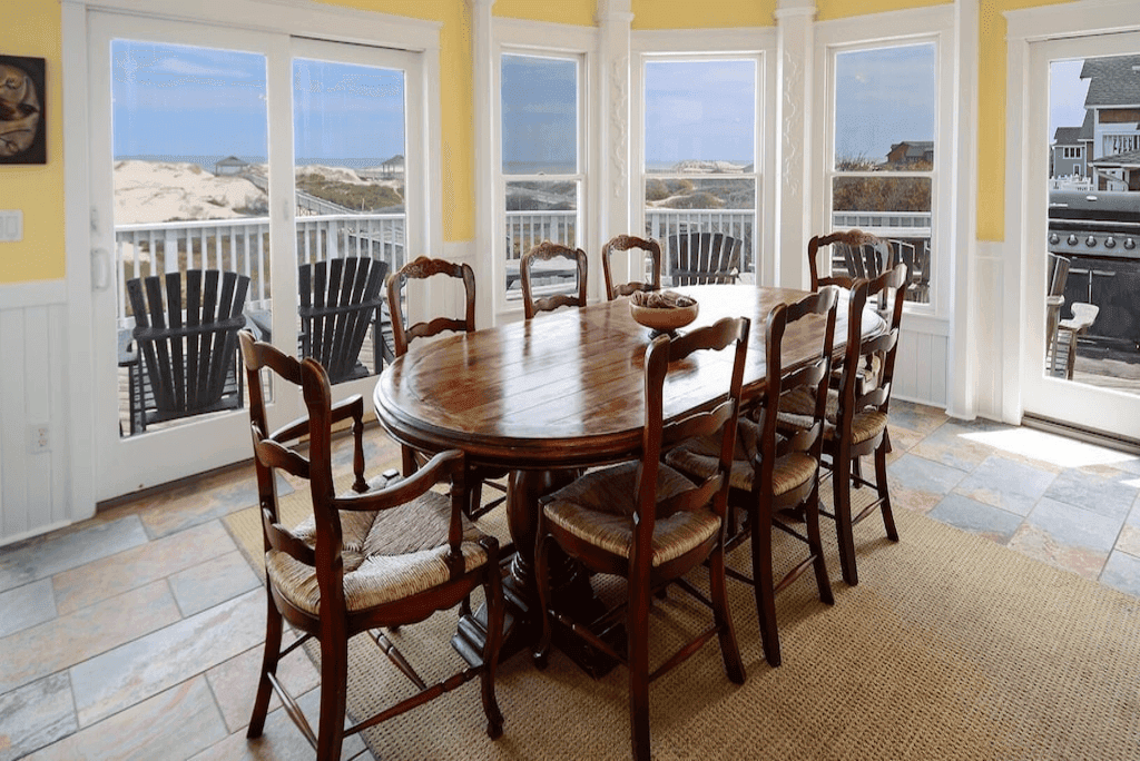 Spacious Dining Area with Breathtaking Ocean Views — Perfect for Group Dinners & Wedding Receptions | Fitzgerald & Hemingway, OBX