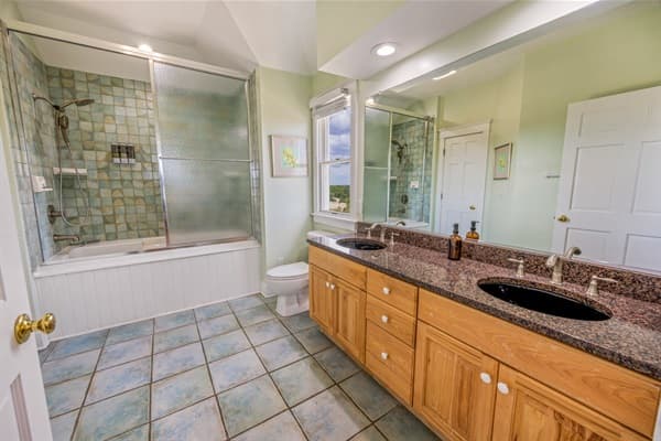 Private Ensuite Bathroom at The Fitzgerald — Elegant Fixtures & Walk-In Shower | 28BR Oceanfront Estate, Outer Banks