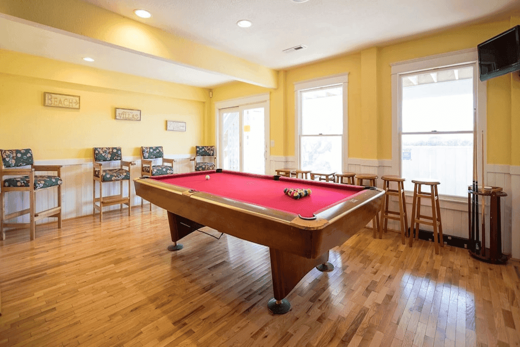Spacious Game Room with Pool Table & Wet Bar — Endless Entertainment for Guests | The Fitzgerald at Outer Banks