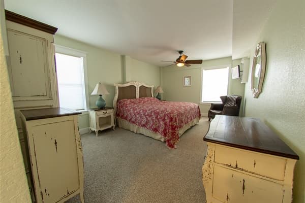 King Bedroom at The Fitzgerald — Serene Space with Warm Tones | 28BR Oceanfront Mega Estate, Outer Banks