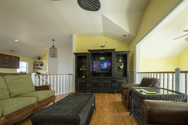 Family Room at The Hemingway with Wet Bar & Captain's Lookout Library — Cozy Lounging | 28BR Estate, Outer Banks