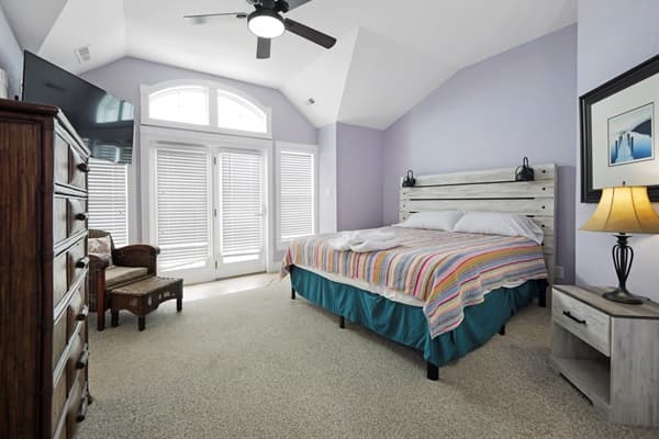 Bedroom 2 at The Hemingway — Comfortable King Bed with Warm Tones | 28BR Oceanfront Estate, Outer Banks