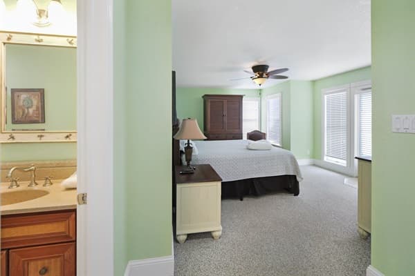 Bedroom 8 at The Hemingway — Cozy King Bed with Warm Lighting | 28BR Oceanfront Estate, Outer Banks