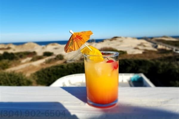 Refreshing Poolside Cocktails — Relax by the Private Heated Pool at Fitzgerald & Hemingway Oceanfront Estate in Corolla Outer Banks