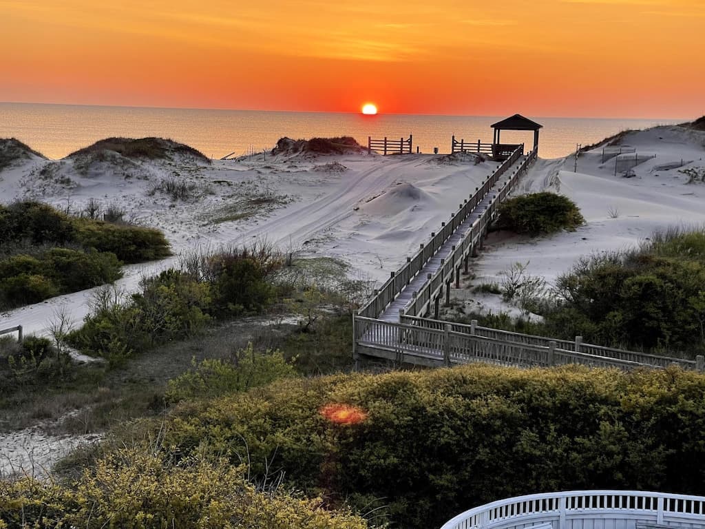 Experience stunning sunrise ocean views from the house, or stroll the boardwalk for an immersive sand-between-your-toes OBX beach moment. The ideal setting for your destination wedding or event.