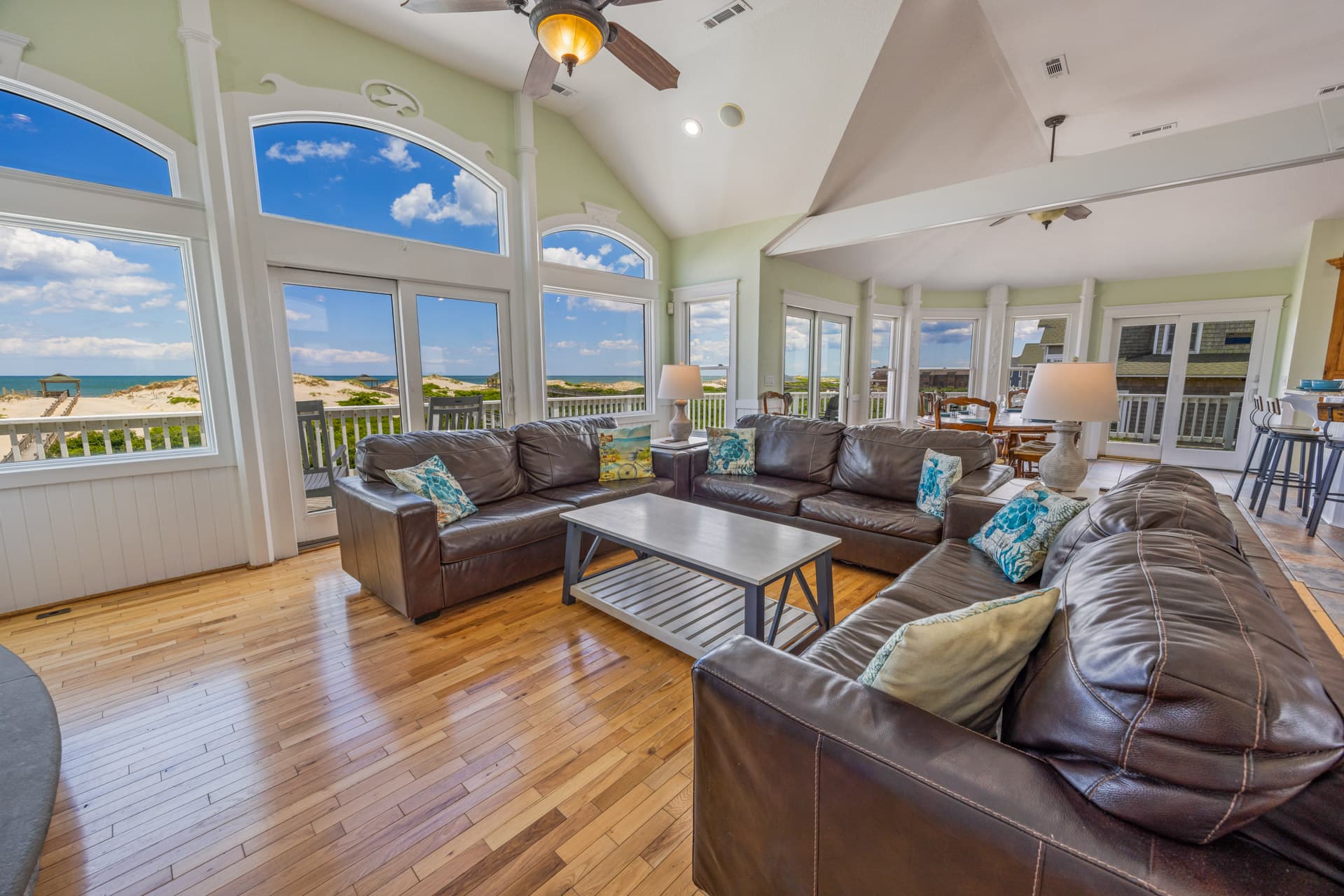 Second living area offering additional gathering space — thoughtfully appointed with ocean-inspired decor and premium furnishings