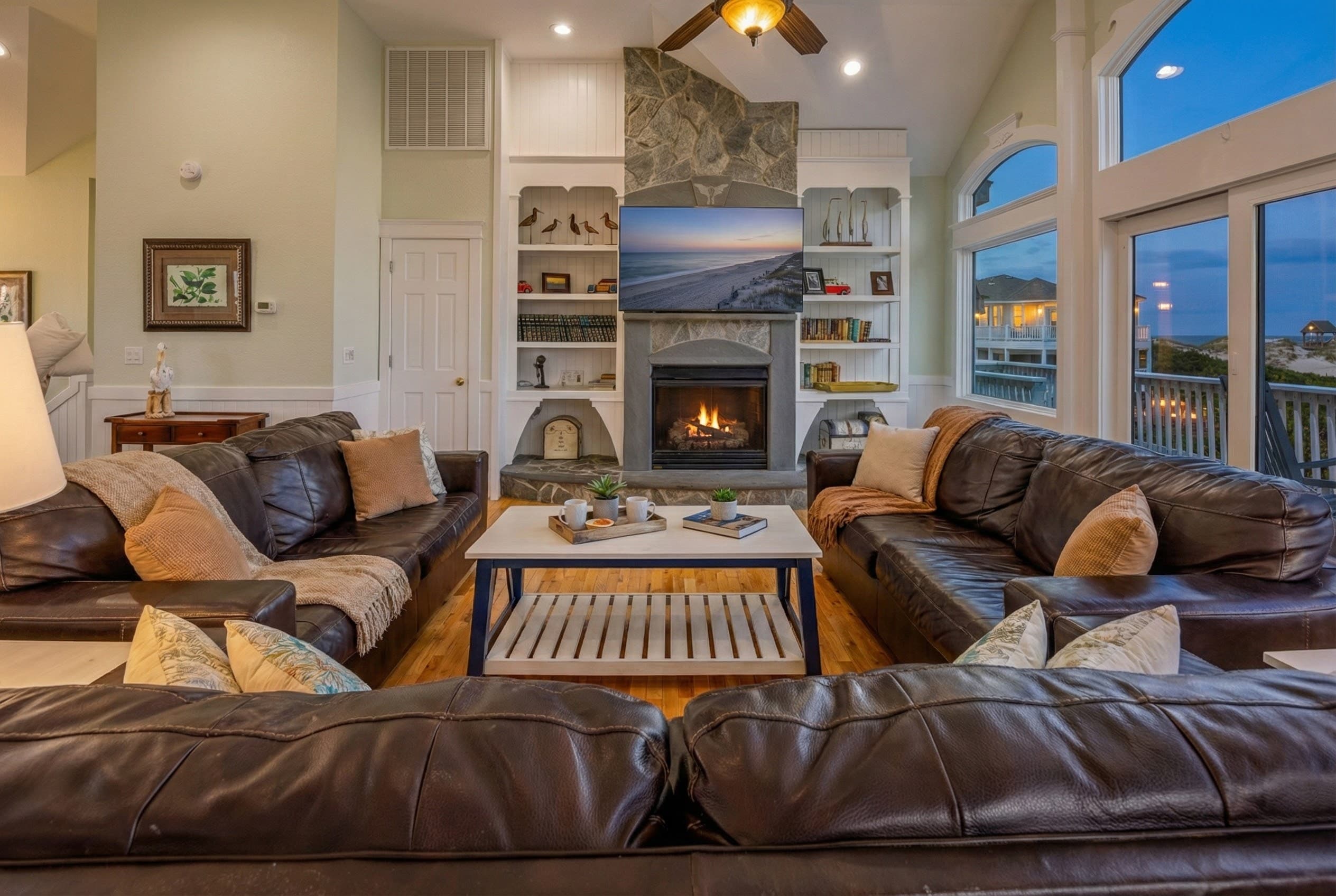Flowing living and dining spaces — open floor plan connects multiple gathering areas for effortless entertaining of large groups