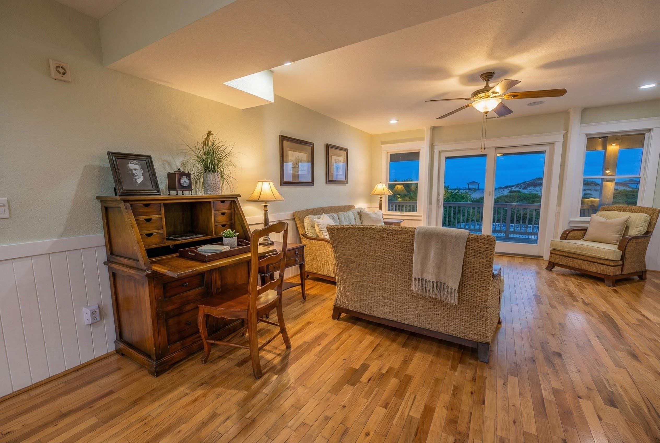 Family room with inviting coastal ambiance — comfortable seating and entertainment area for relaxed evenings at the estate