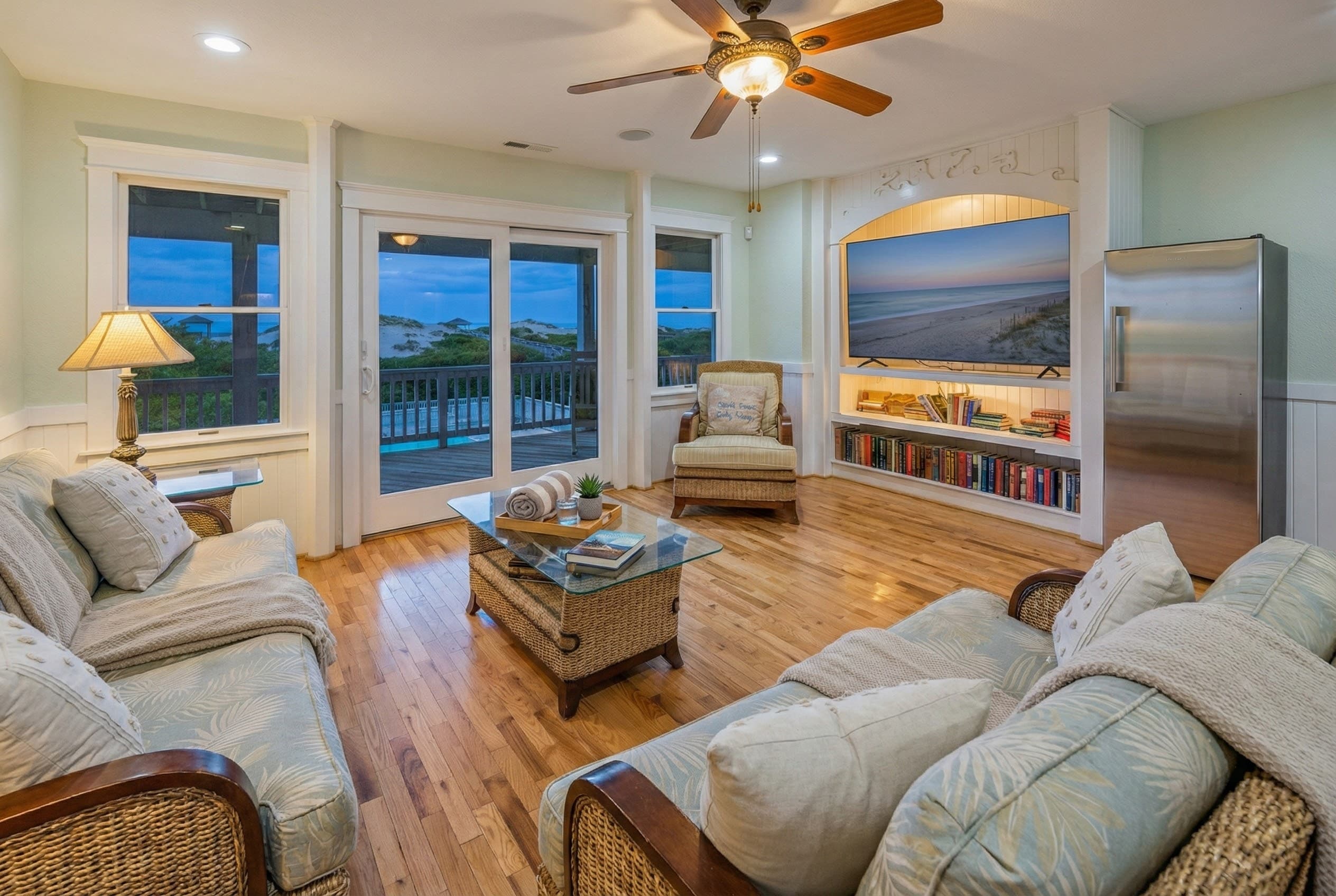 Additional family gathering space — versatile room with premium furnishings and coastal decor for comfortable togetherness