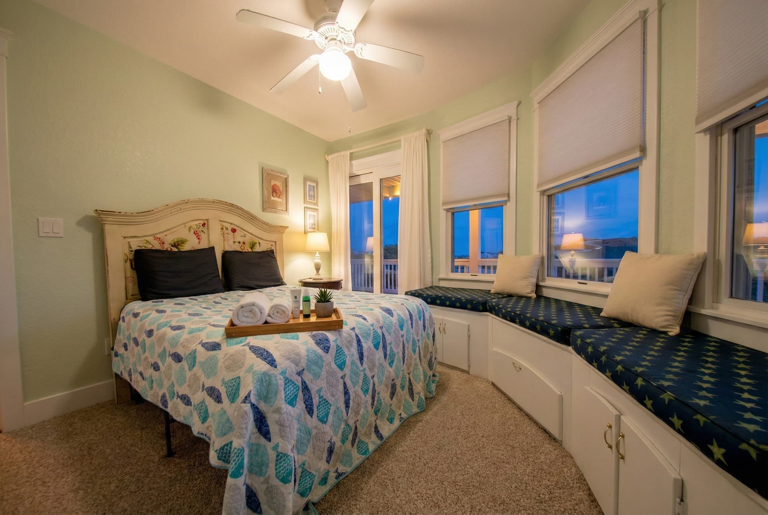 King suite with ocean-inspired teal palette — plush bedding and refined accents create a tranquil sanctuary for guests