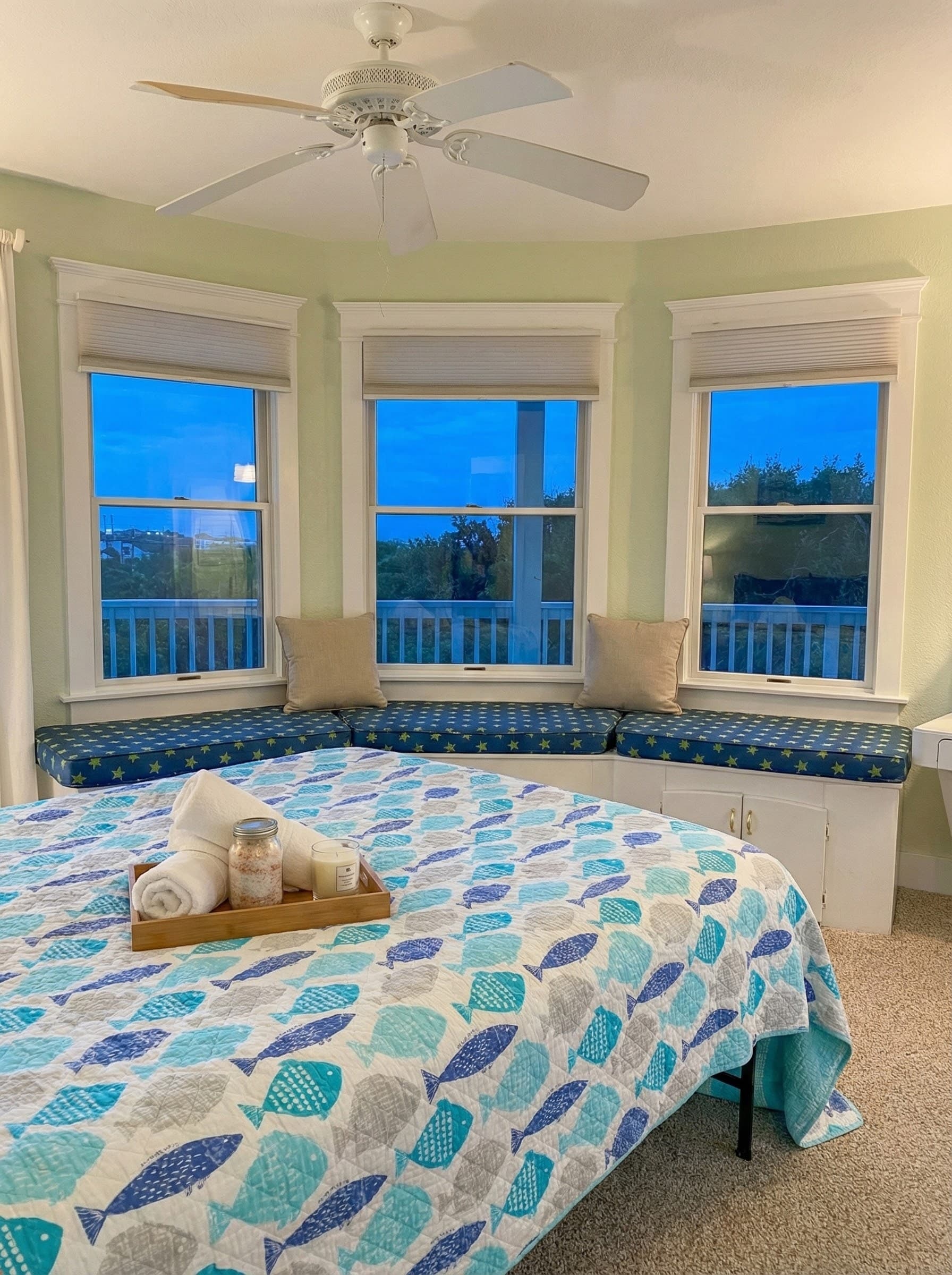 Bedroom retreat with coastal elegance — premium bedding and curated decor offer a serene escape within the estate