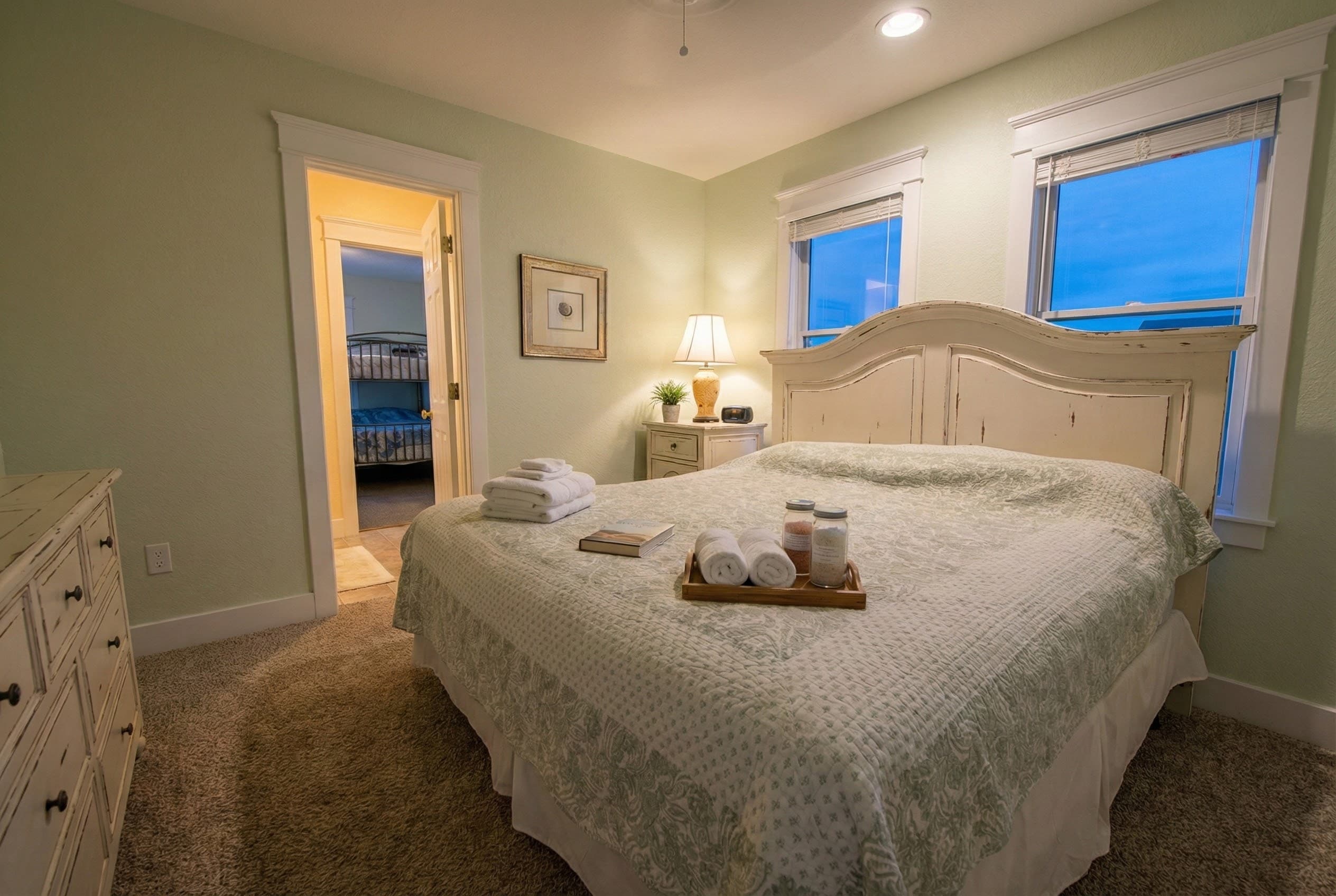 Serene king bedroom in soft ivory tones — a peaceful retreat with premium appointments designed for rejuvenating sleep