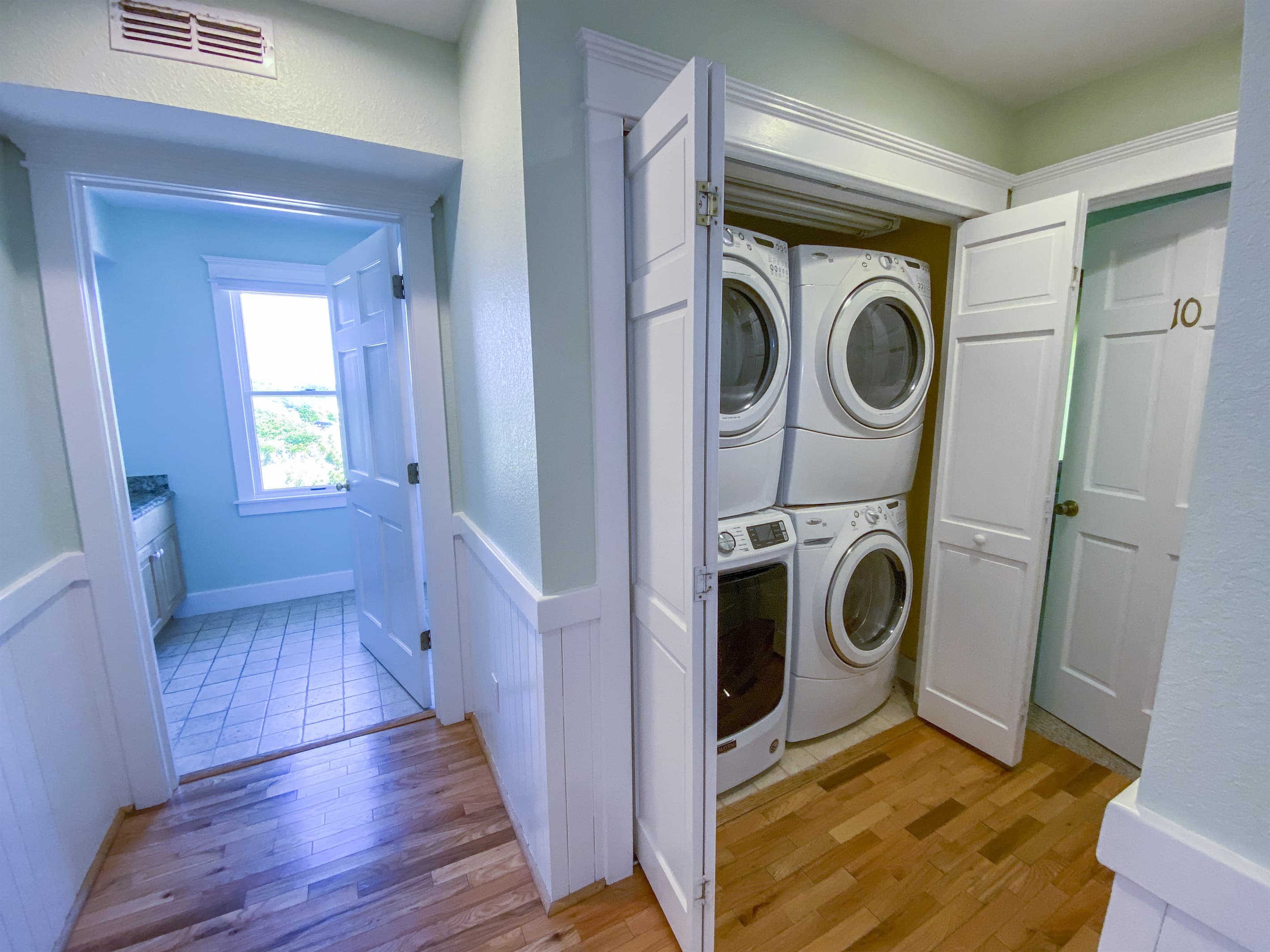 Second-floor laundry suite — full-size washer and dryers for the convenience of extended luxury stays