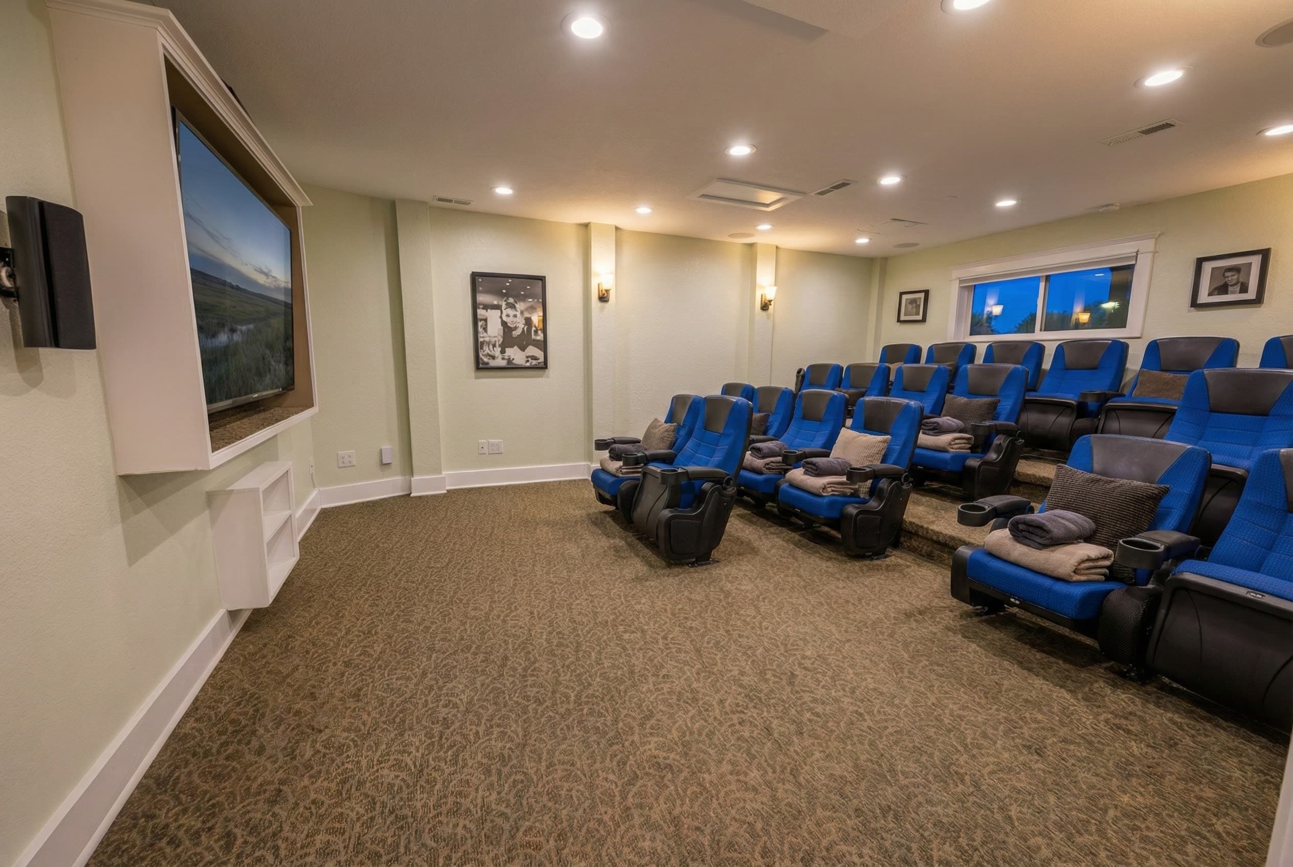 Private cinema room — plush theater-style seating and premium screen for movie nights in absolute comfort