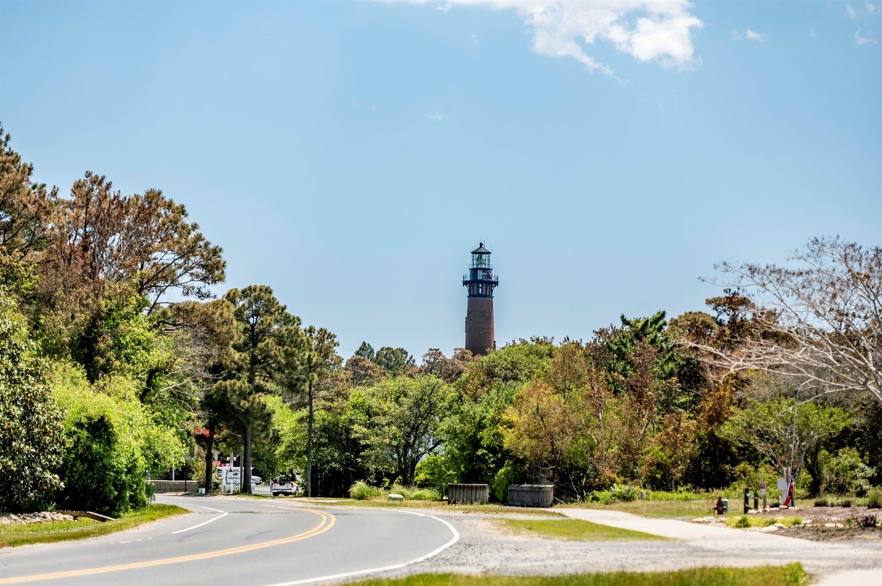 Corolla roadway with lighthouse views — scenic drives through this exclusive Outer Banks community