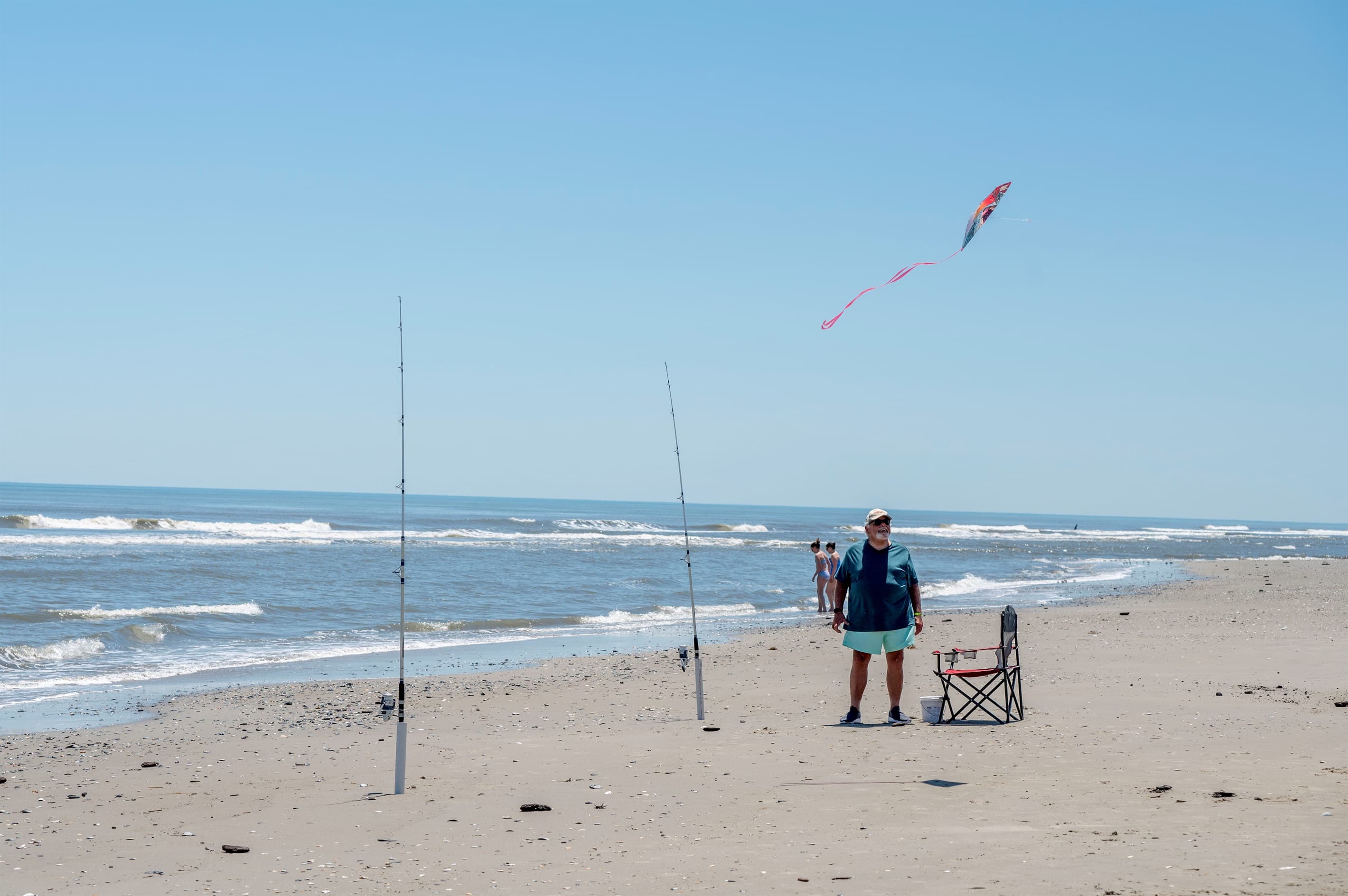 Expansive beach panorama — uncrowded Corolla shoreline offers space and serenity for your luxury coastal getaway
