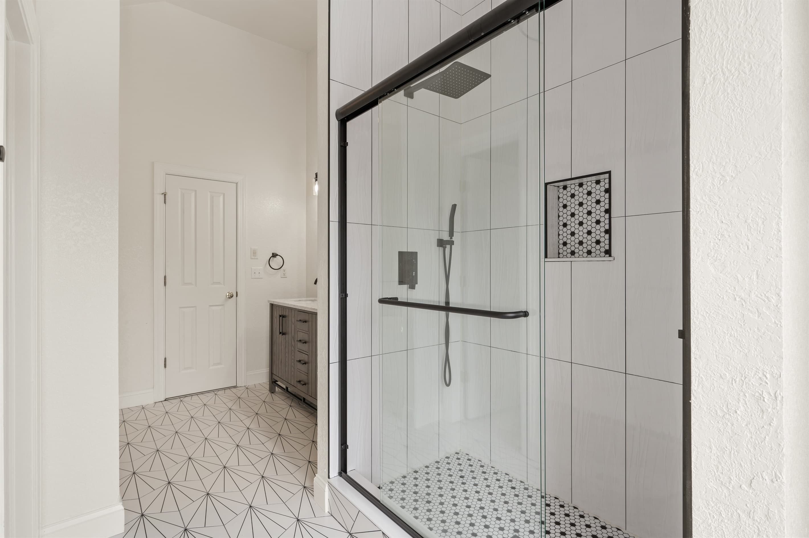 Ensuite Bath 1 — Spa-Like Walk-In Shower with Glass Enclosure | Soundside Pearl, Duck NC
