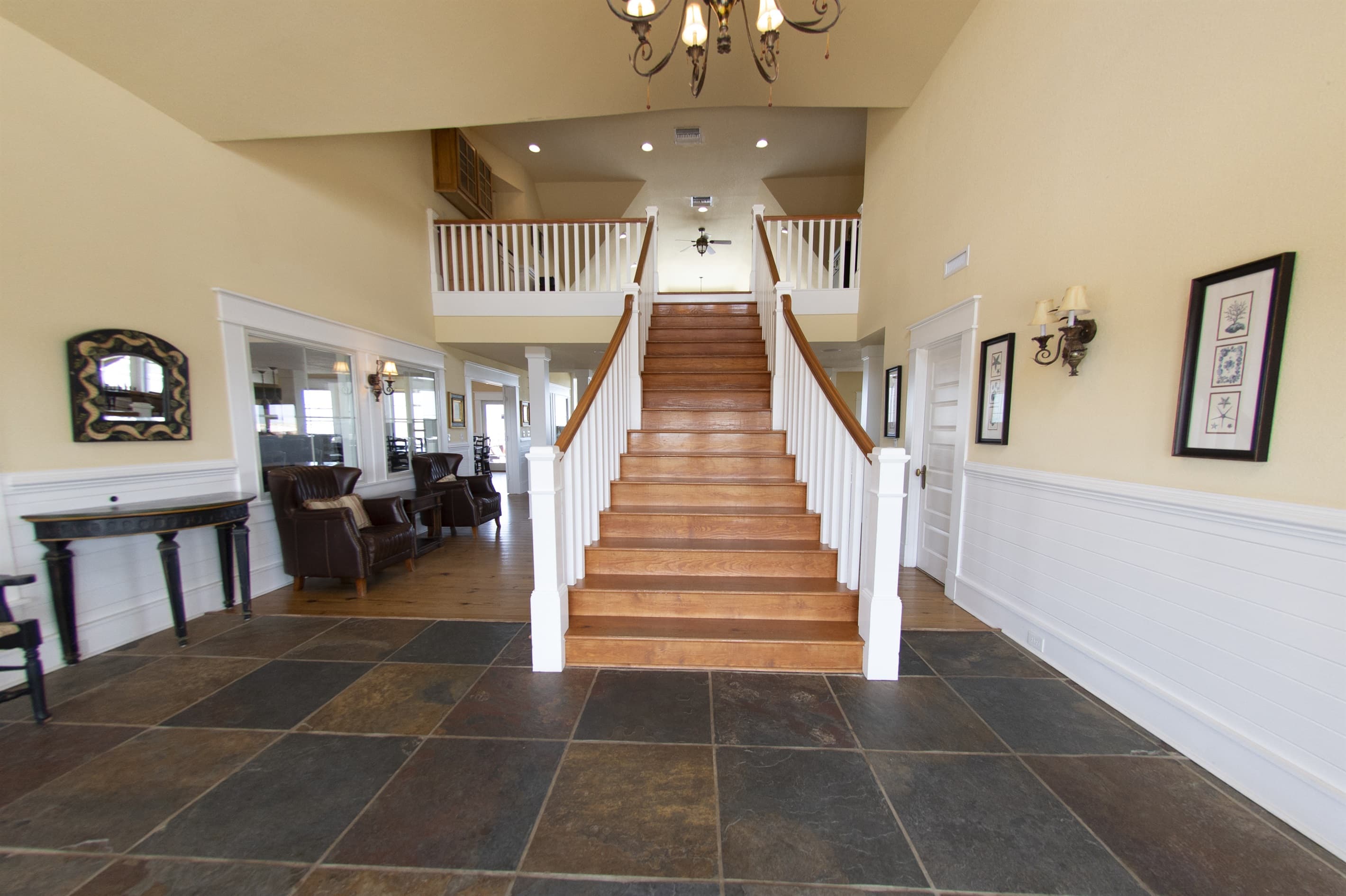 Welcome to The Mark Twain — Grand Staircase Entry to Your Oceanfront Estate Experience | 18 Bedrooms, Sleeps 40 | Outer Banks Luxury