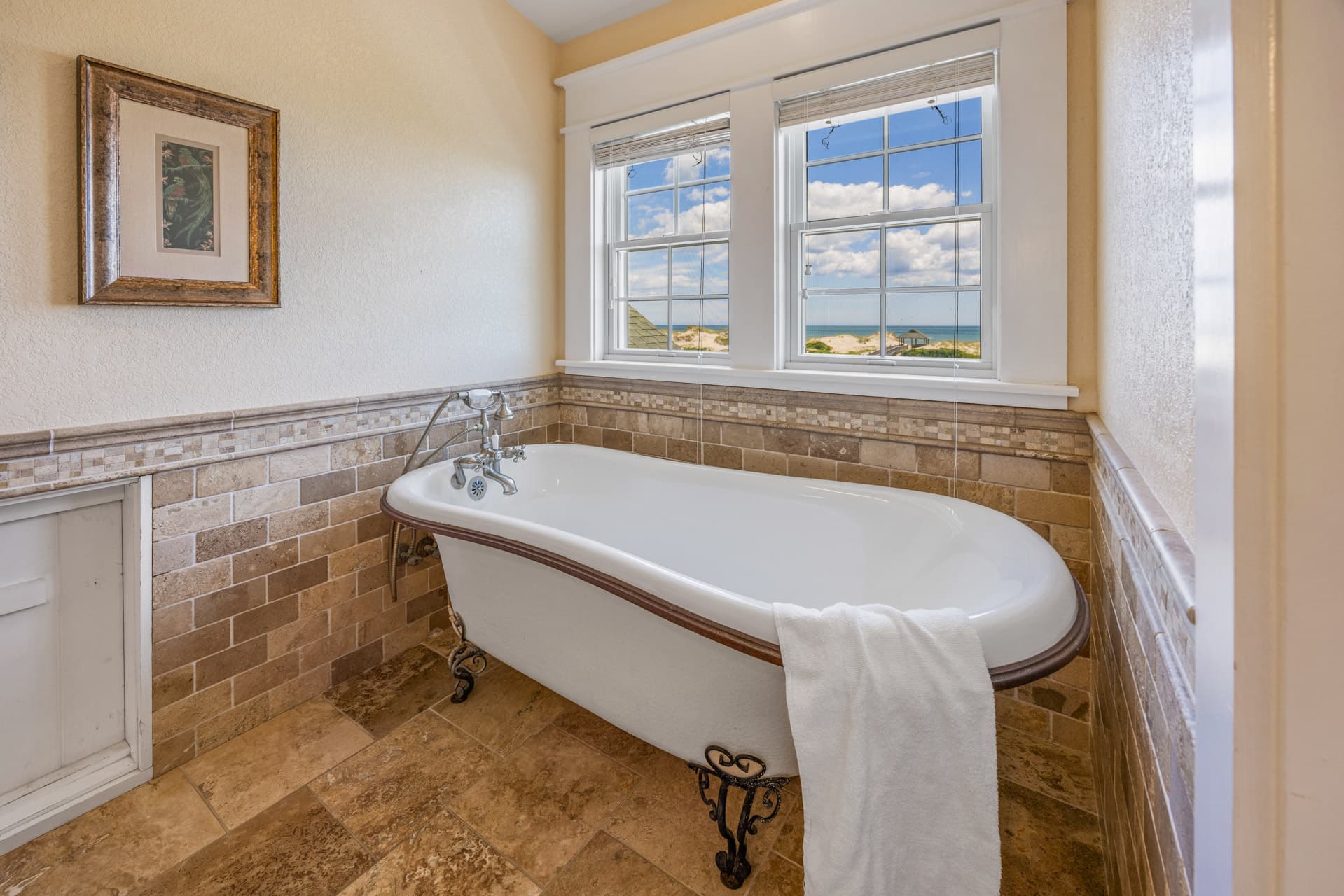 Bedroom — Luxurious King Suite with Plush White Bedding & Elegant Headboard | The Mark Twain's Premium Accommodations, Outer Banks