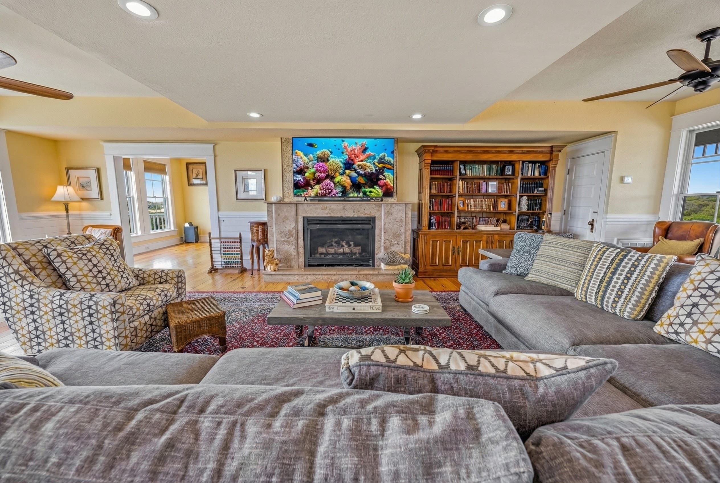 Comfortable Living Space with Ocean Views & Smart TV — One of Multiple Gathering Areas | The Mark Twain Oceanfront Estate, Outer Banks