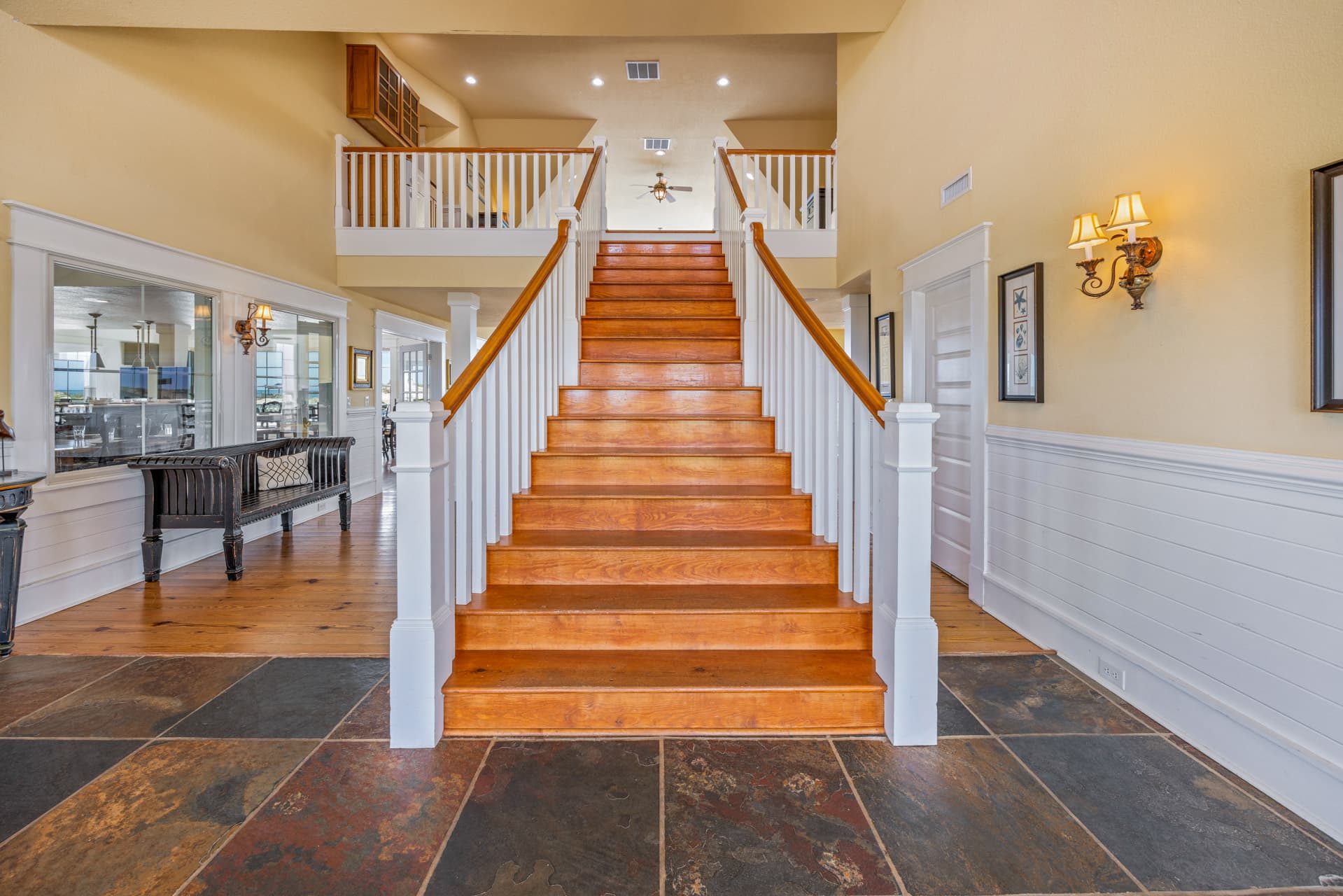 Grand Interior Staircase with Warm Wood & Elegant Lighting — Multi-Level Design Connecting All 3 Floors | The Mark Twain Estate, Outer Banks