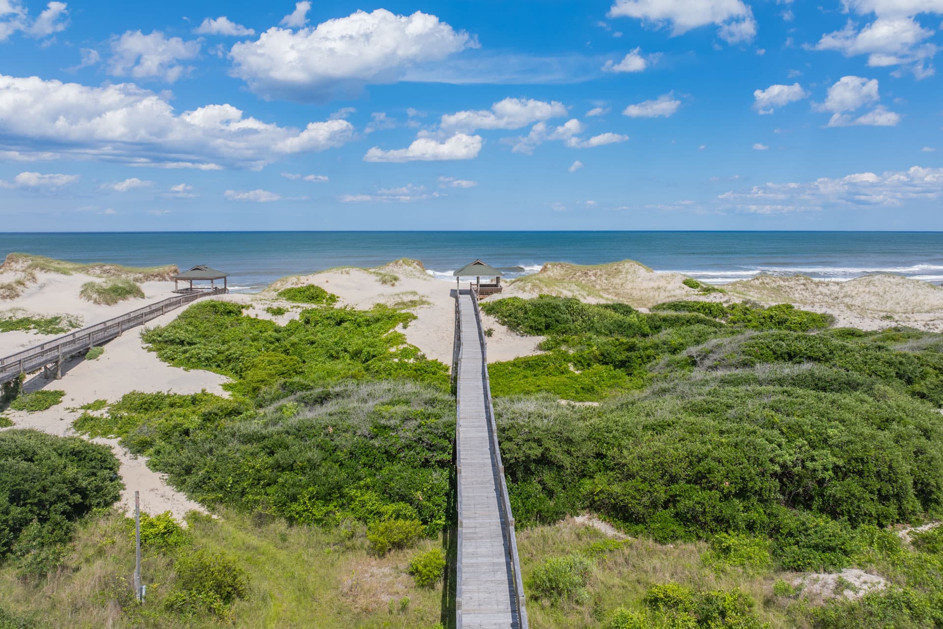 Aerial Beachfront View of The Mark Twain — Pristine Shoreline & Natural Dunes on Corolla's Exclusive 4x4 Beach | Outer Banks Luxury Vacation
