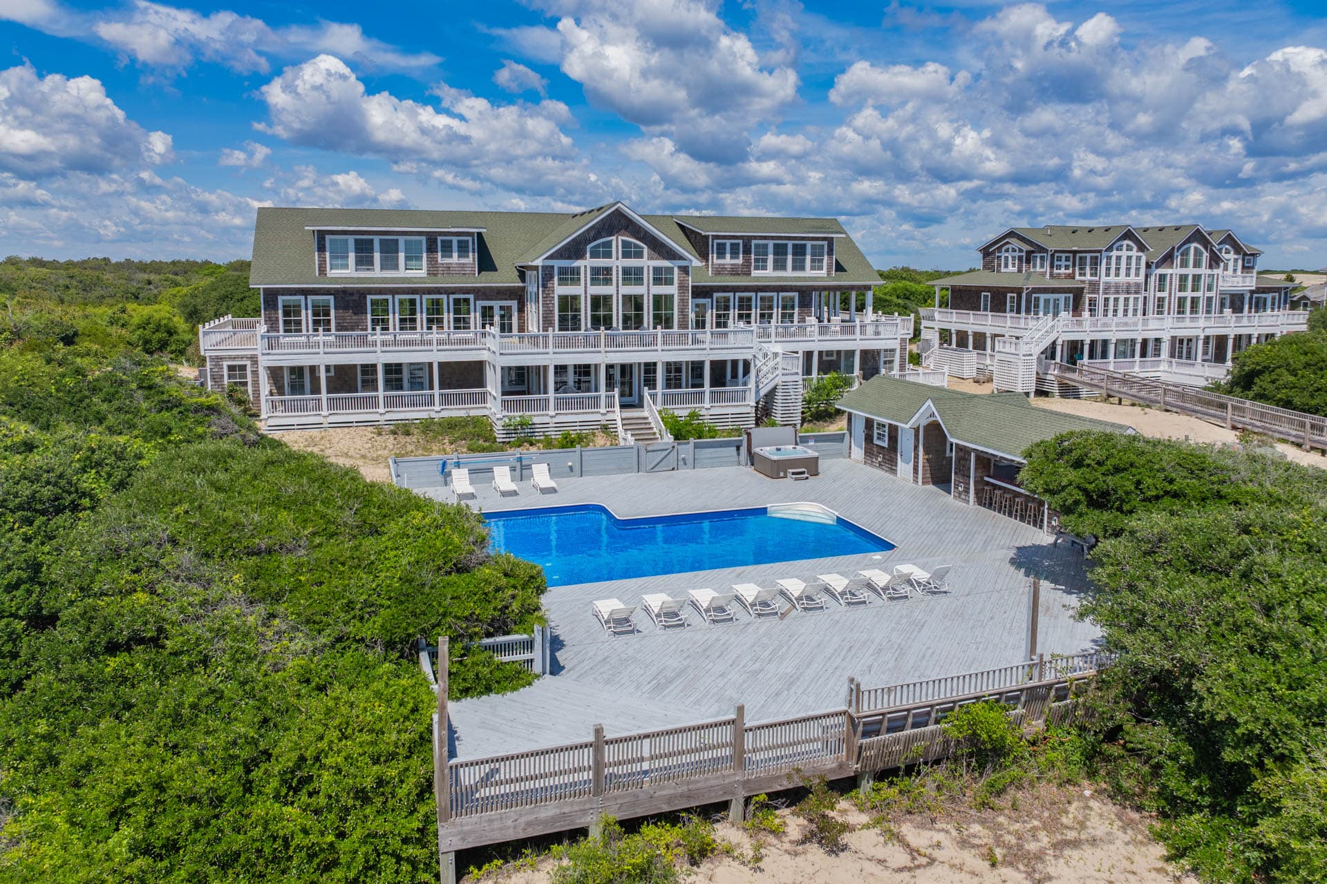 Stunning Nighttime View of The Mark Twain with Illuminated Pool & Oceanfront Decks — Luxury Estate for Large Groups | Outer Banks Beachfront