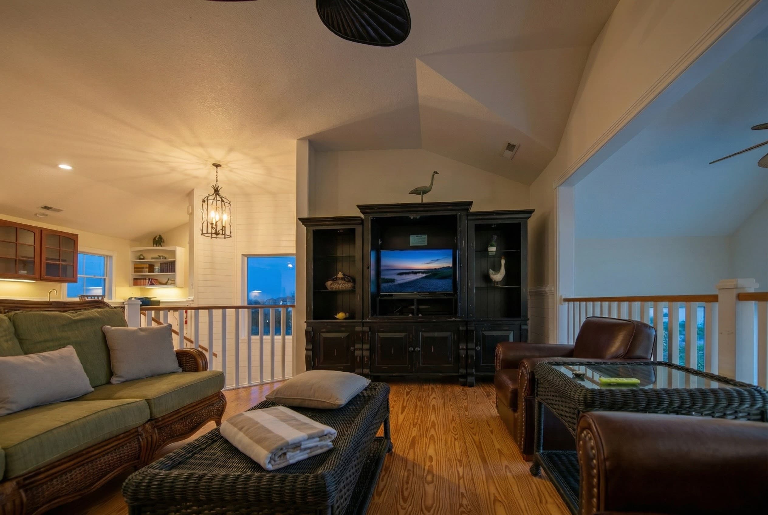 Inviting Family Room with Wet Bar, Captain's Lookout Library & Plush Seating — Ocean Views & Cozy Atmosphere | The Hemingway Oceanfront Estate