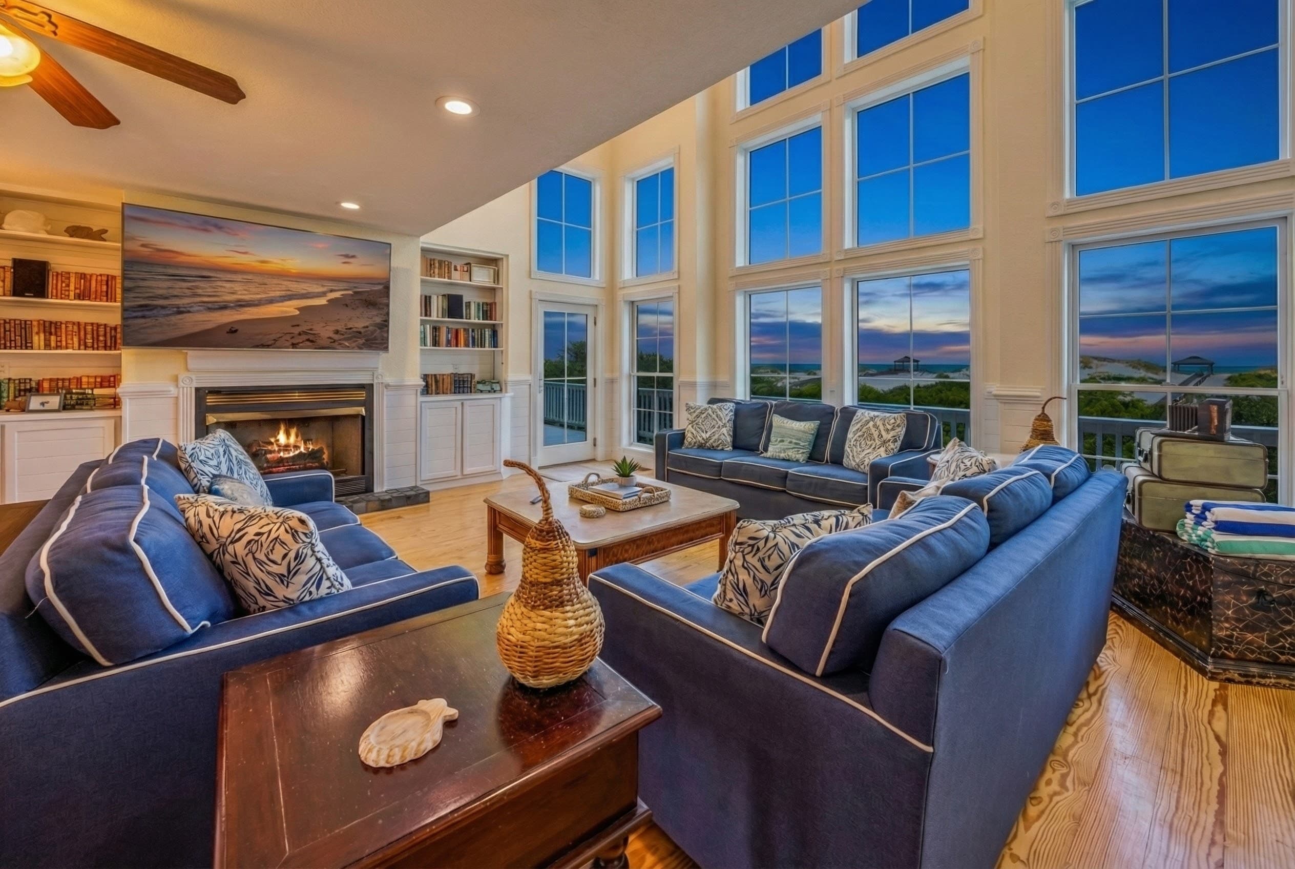 Luxury Great Room with Panoramic Ocean Views at Blue Hour — Elegant Coastal Design, Plush Seating & Open Floor Plan | The Hemingway, Outer Banks