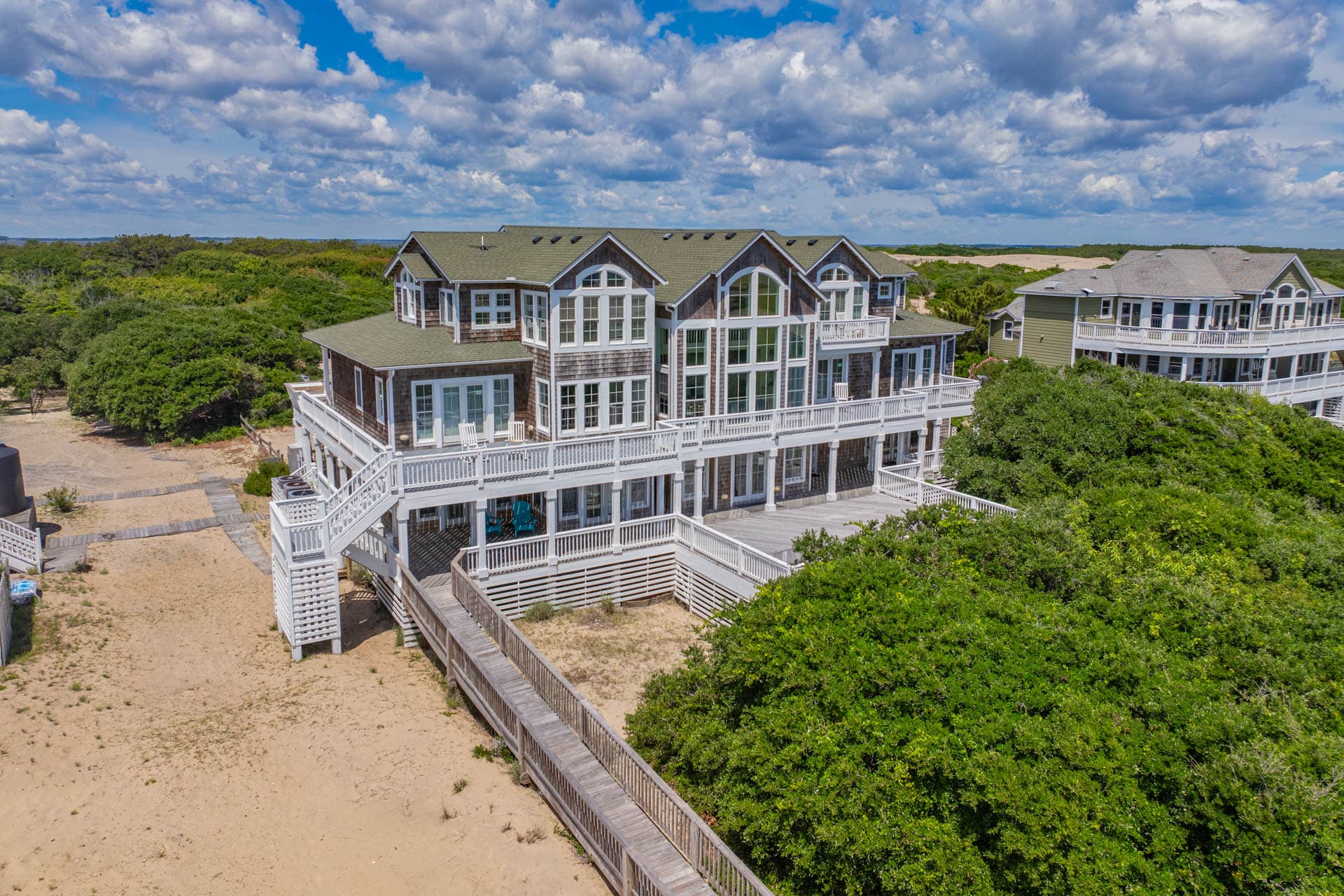 Side View Showing Multiple Levels & Expansive Decking — Grand Oceanfront Estate | Corolla, Outer Banks Luxury Rental