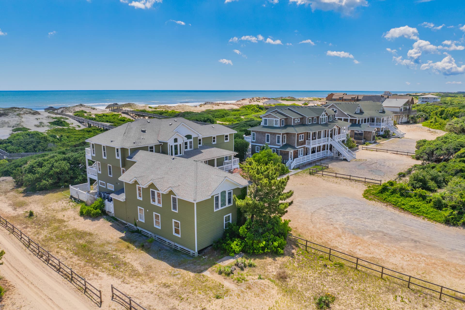 Exclusive Estate Aerial — Full Property View Showing Pool, Dual Estates and Oceanfront Event Grounds, Corolla OBX