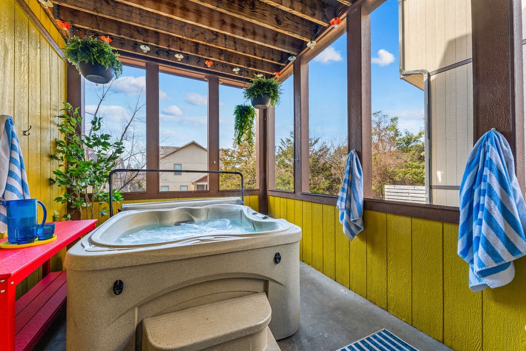 Soak year-round in the private hot tub, tucked into a screened porch surrounded by forest