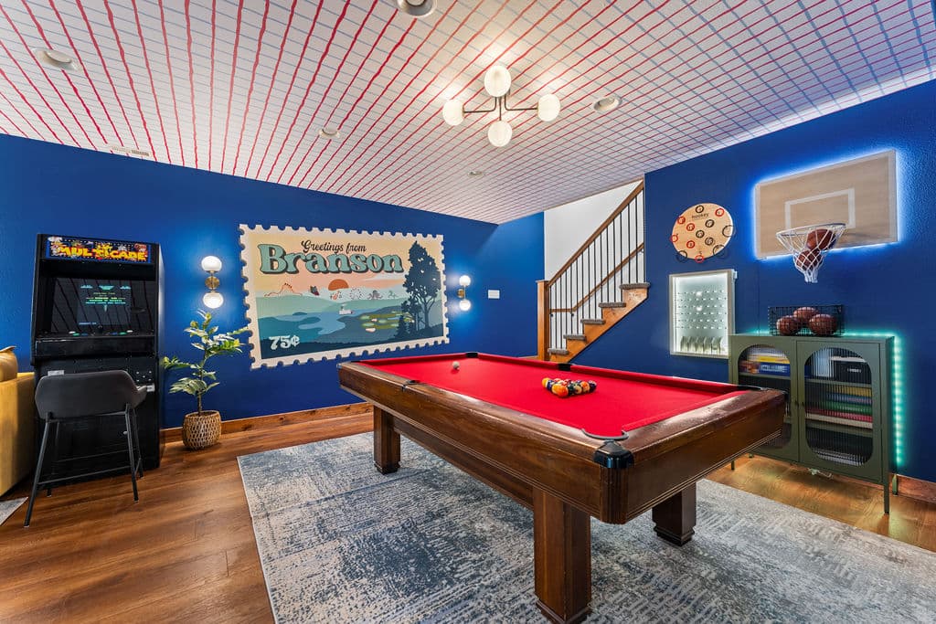 Snap a photo at the Branson mural, then pick your game — hookey, basketball, plinko, or pool